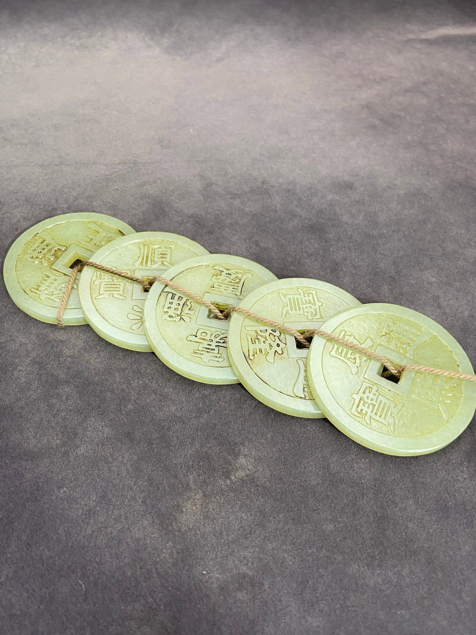 An Exquisite White Jade Five Emperor Coins Pendant: An Exquisite White Jade Five Emperor Coins Pendant,Qing Dynasty,China,Size:2inx0.2in,Weight:111g 白玉五帝钱挂件,中国清代