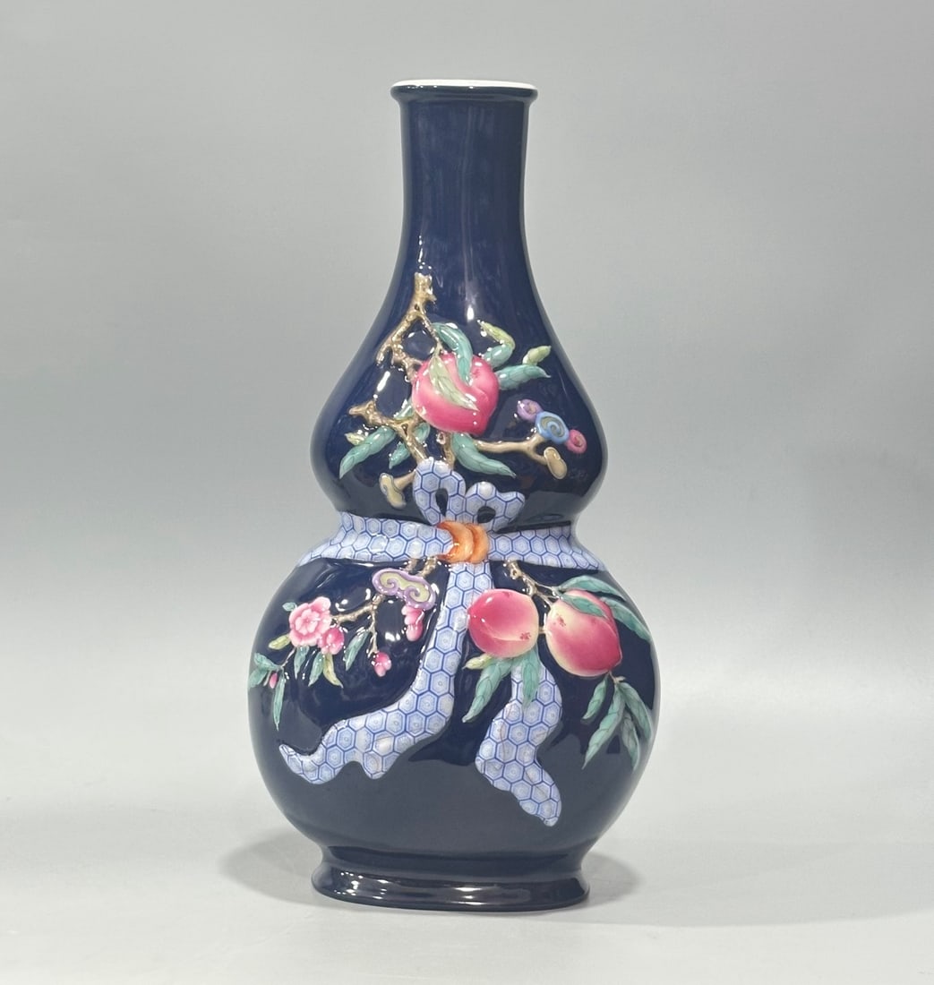 An Exquisite Enamel Ji Blue Glazed Flower and Fruit Pattern Gourd-Shaped Vase: An Exquisite Enamel Ji Blue Glazed Flower and Fruit Pattern Gourd-Shaped Vase,Qing Dynasty,China,Qianlong Four-character Mark,Size:10.8inx5.5in
