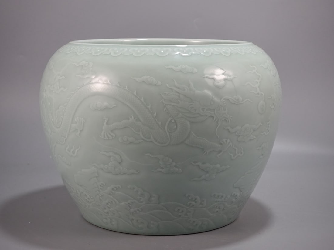 A Rare Celadon Glazed Seawater,Auspicious Cloud and Dragon Pattern Vat: A Rare Celadon Glazed Seawater,Auspicious Cloud and Dragon Pattern Vat,Qing Dynasty,China,Qianlong Six-character Mark,Size:10.6inx13.6in