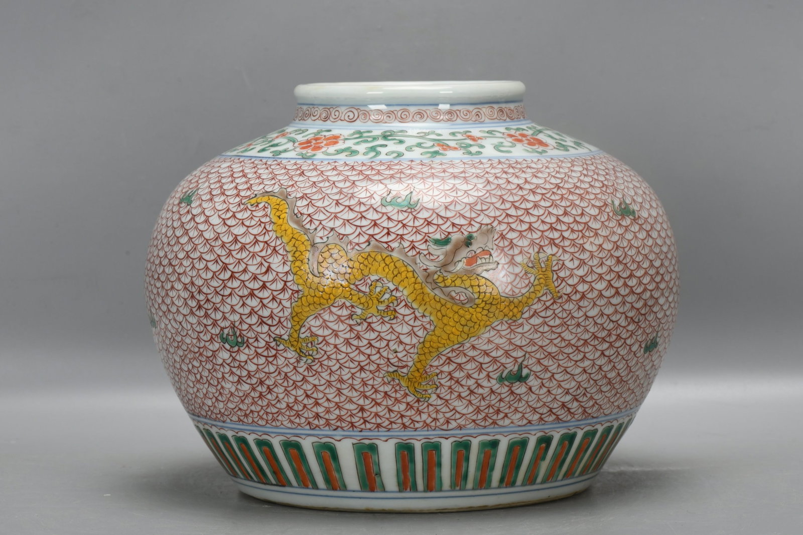 An Exquisite Wucai Lotus and Dragon Pattern Jar: An Exquisite Wucai Lotus and Dragon Pattern Jar,Qing Dynasty,China,Size:7.7inx10.2in 五彩缠枝莲龙纹罐,中国清代