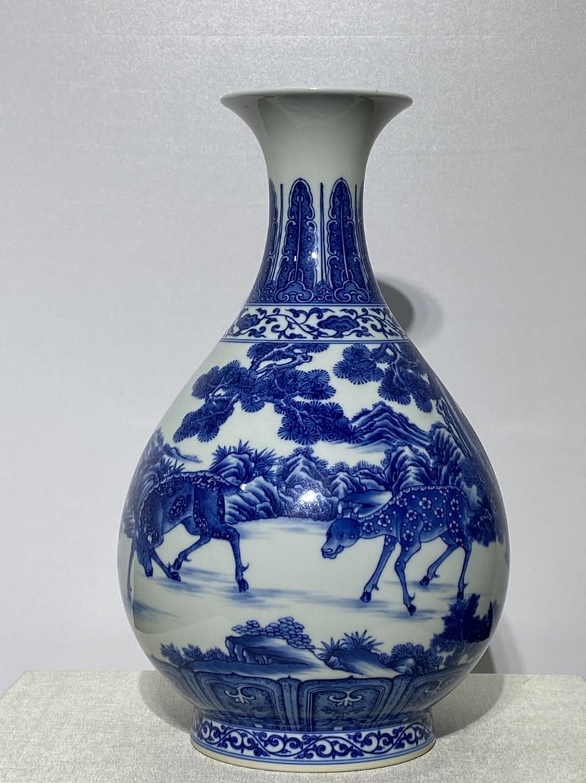 A Rare Blue and White Pine and Deer Pattern Vase: A Rare Blue and White Pine and Deer Pattern Vase,Qing Dynasty,China,Qianlong Six-character Mark,Size:13.4inx8.3in 青花松鹿纹瓶,中国清代,