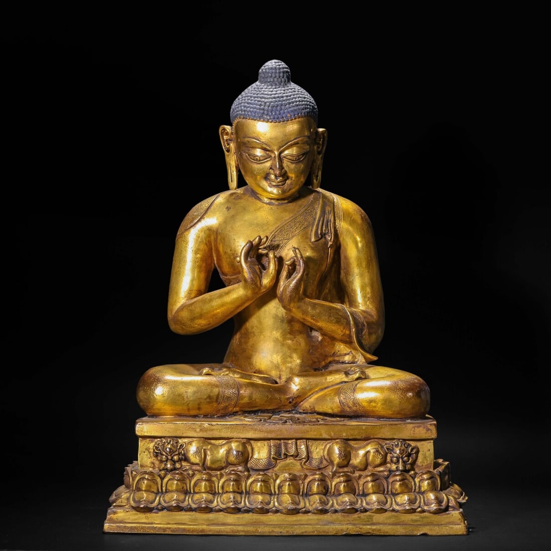 A Solemn Gilt Bronze Statue of Sakyamuni: A Solemn Gilt Bronze Statue of Sakyamuni,Ming Dynasty,China,Size:12.6inx7.5inx16.9in,Weight:11000g 铜鎏金释迦摩尼像,中国明代