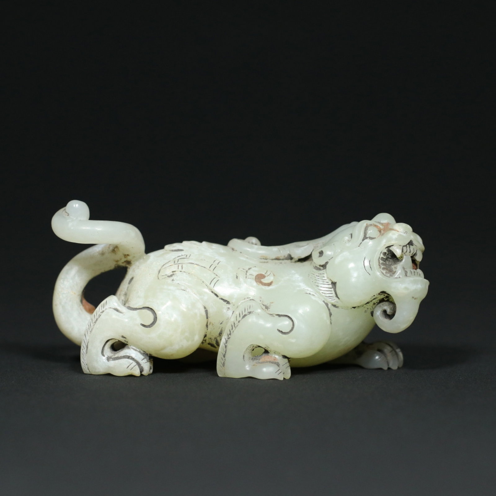 An Exquisite White Jade Auspicious Beast Ornament: An Exquisite White Jade Auspicious Beast Ornament,Han Dynasty,China,Size:3.7inx1.7inx1.7in,Weight:167.6g 白玉瑞兽摆件,中国汉代