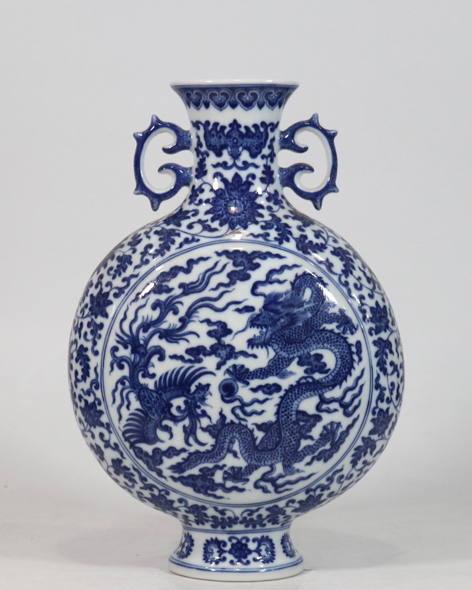 A Rare Blue and White Dragon and Phoenix Pattern Double-Ears Vase: A Rare Blue and White Dragon and Phoenix Pattern Double-Ears Vase,Qing Dynasty,China,Qianlong Six-character Mark,Size:12.6inx8.3in