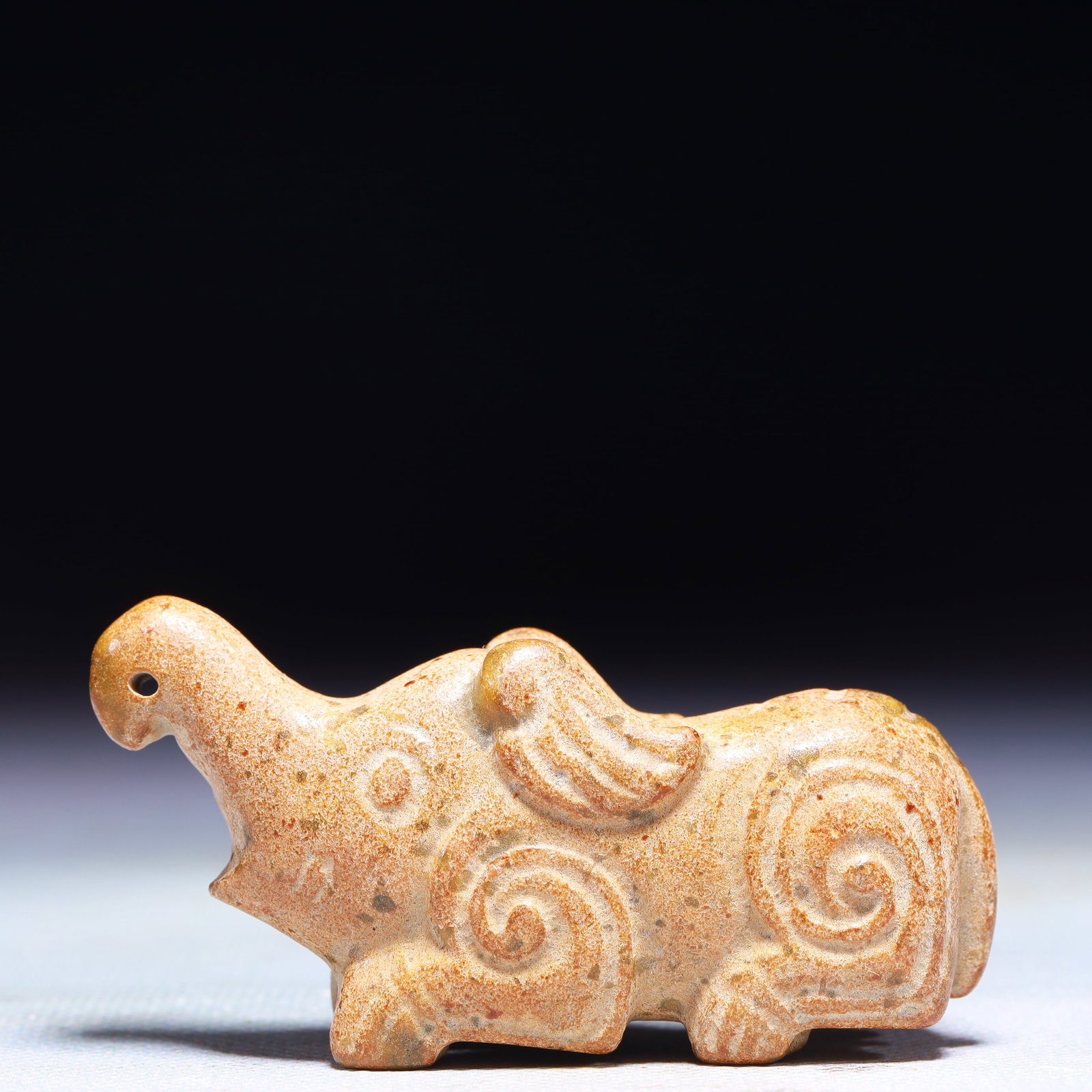 An Exquisite Archaic Jade Elephant Ornament: An Exquisite Archaic Jade Elephant Ornament,Ancient Time,China,Size:2.8inx0.8inx1.2in,Weight:82g 高古玉象摆件中国远古时期