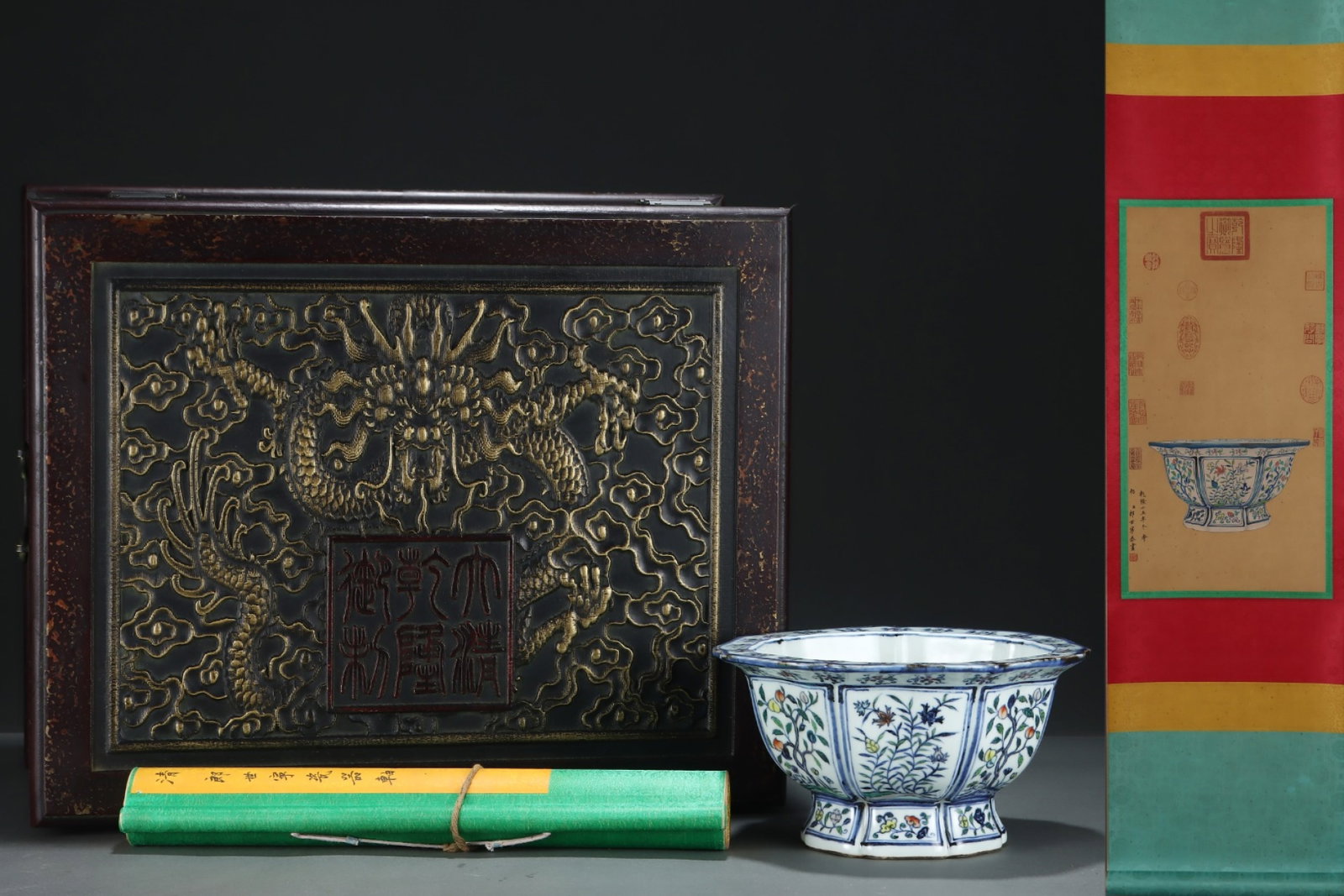 An Exquisite Wucai Flower and Fruit Pattern Flowerpot,with Chinese Vertical Scroll Ink Painting on: An Exquisite Wucai Flower and Fruit Pattern Flowerpot,with Chinese Vertical Scroll Ink Painting on Silk,Ming Dynasty,China,Xuande Six-character Mark,Size:(Without frame)23.4inx12.2in,(Porcelain)5inx9.