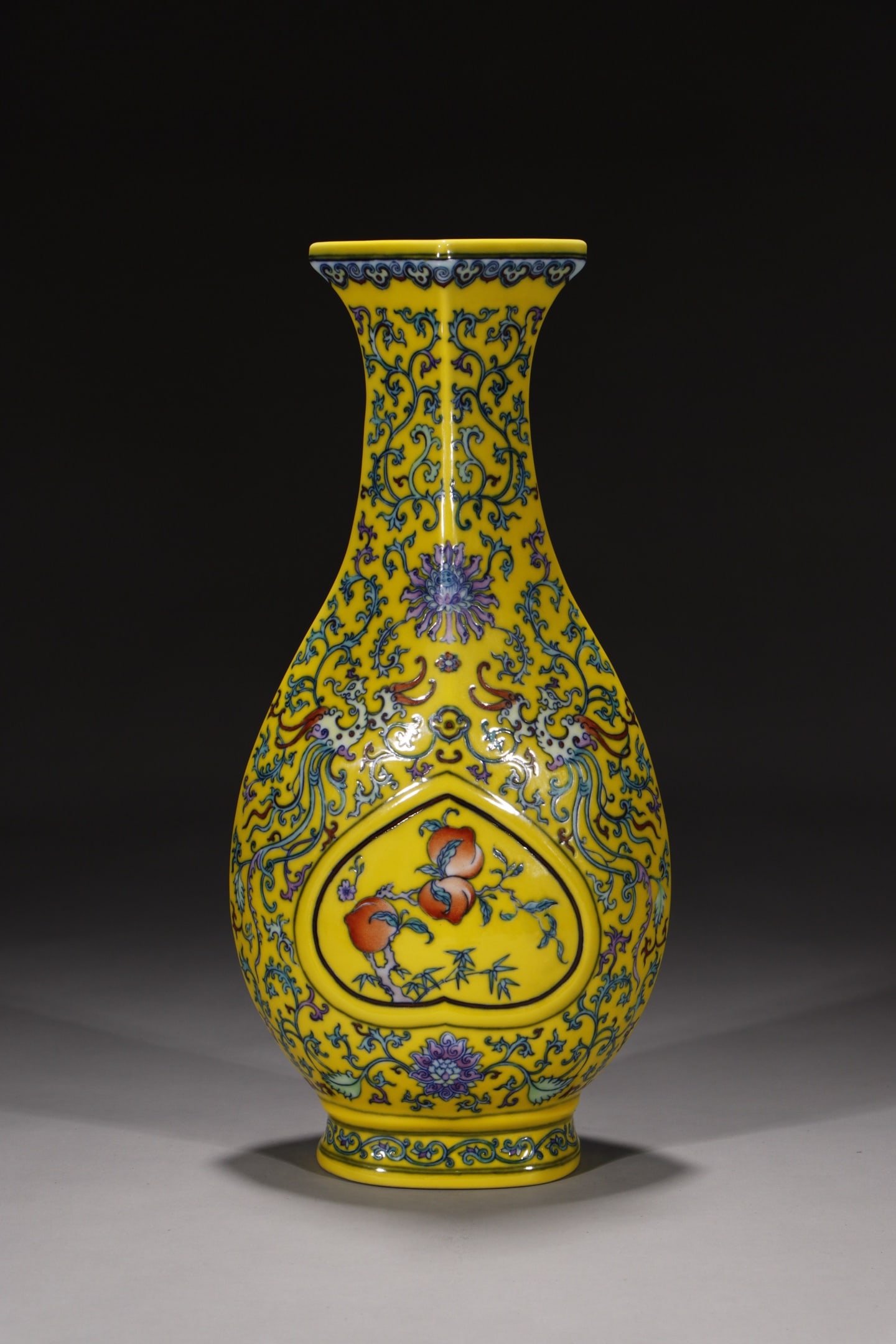 A Rare Yellow Ground Doucai Lotus,Phoenix and Peach Pattern Vase: A Rare Yellow Ground Doucai Lotus,Phoenix and Peach Pattern Vase,Qing Dynasty,China,Qianlong Six-character Mark,Size:14in