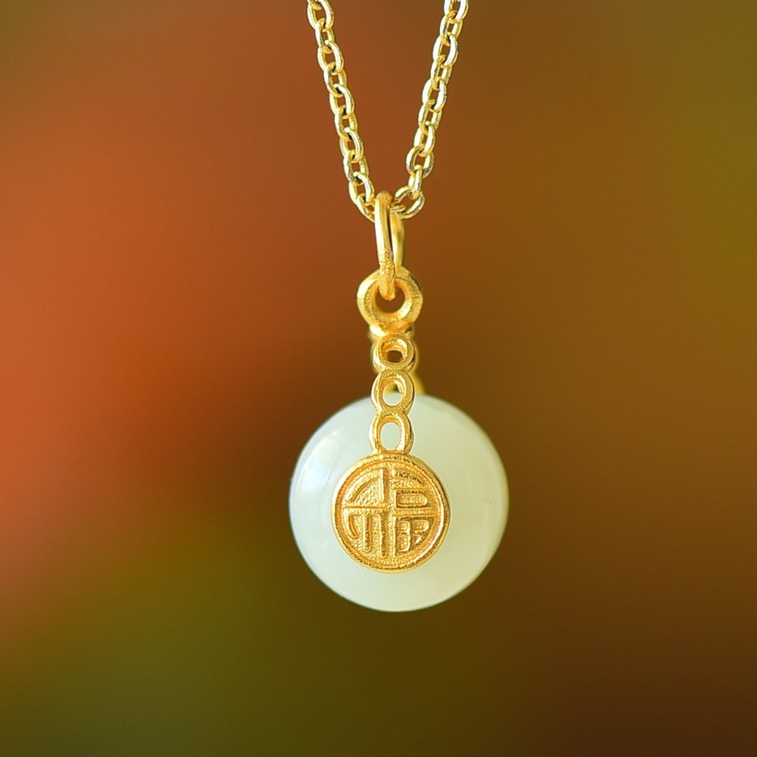An Exquisite Sterling Silver-Gold Plated Inlaid White Jade Pendant: An Exquisite Sterling Silver-Gold Plated Inlaid White Jade Pendant,Size:0.3inx0.4in 纯银镀金镶白玉吊坠