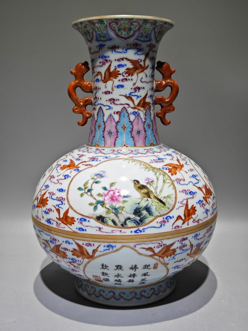 An Exquisite Enamel Flower and Bird Pattern with poem Double-Ears Vase: An Exquisite Enamel Flower and Bird Pattern with poem Double-Ears Vase Qing Dynasty, China Qianlong Six-character Mark Size:12.8inx9.1in珐琅彩云鹤纹开光