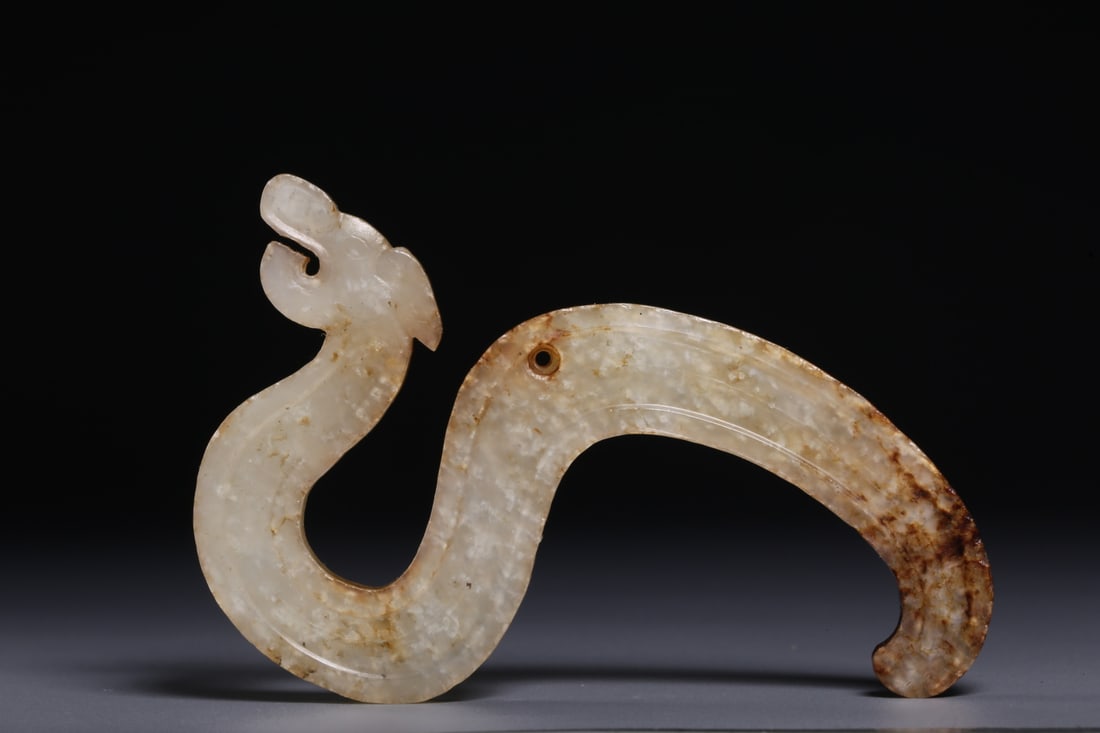 An Exquisite White Jade Dragon Ornament: An Exquisite White Jade Dragon Ornament Han Dynasty, China Size:3.5inx1.9inx0.2in Weight:24.2g白玉龙佩 中国汉代 Size:8.8cmx4.7cmx0.5cm Weight:24.2g