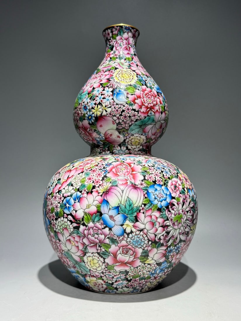 An Exquisite Famille-Rose Flower Pattern Gourd-Shaped Vase: An Exquisite Famille-Rose Flower Pattern Gourd-Shaped Vase Qing Dynasty, China Qianlong Six-character Mark Size:13.3inx7.9in粉彩黑地万花葫芦瓶 