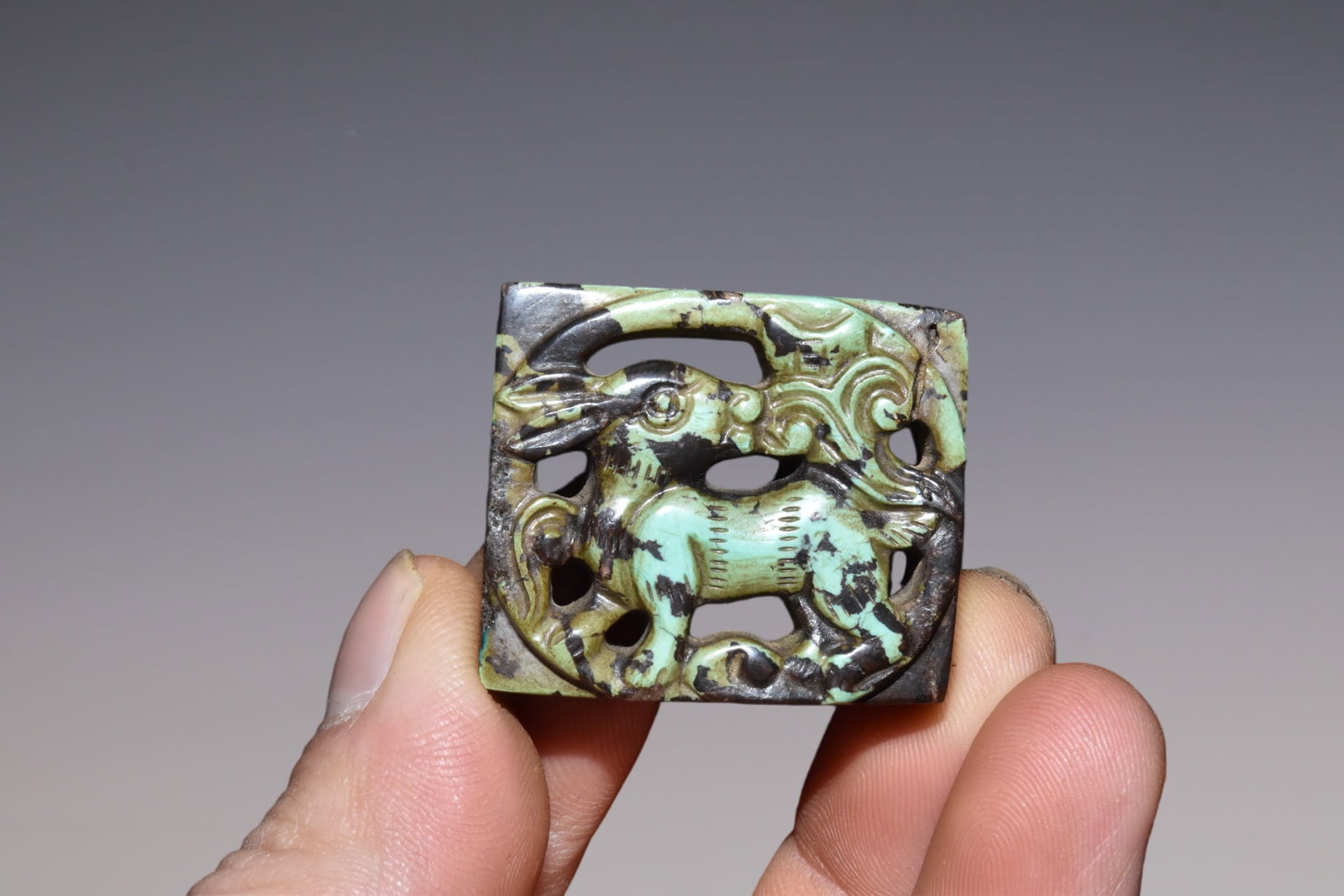 An Exquisite Turquoise Brand: An Exquisite Turquoise Brand Liao Dynasty, China Size:1.6inx1.2in Weight:20g松石牌子 中国辽代 Size:4cmx3cm Weight:20g