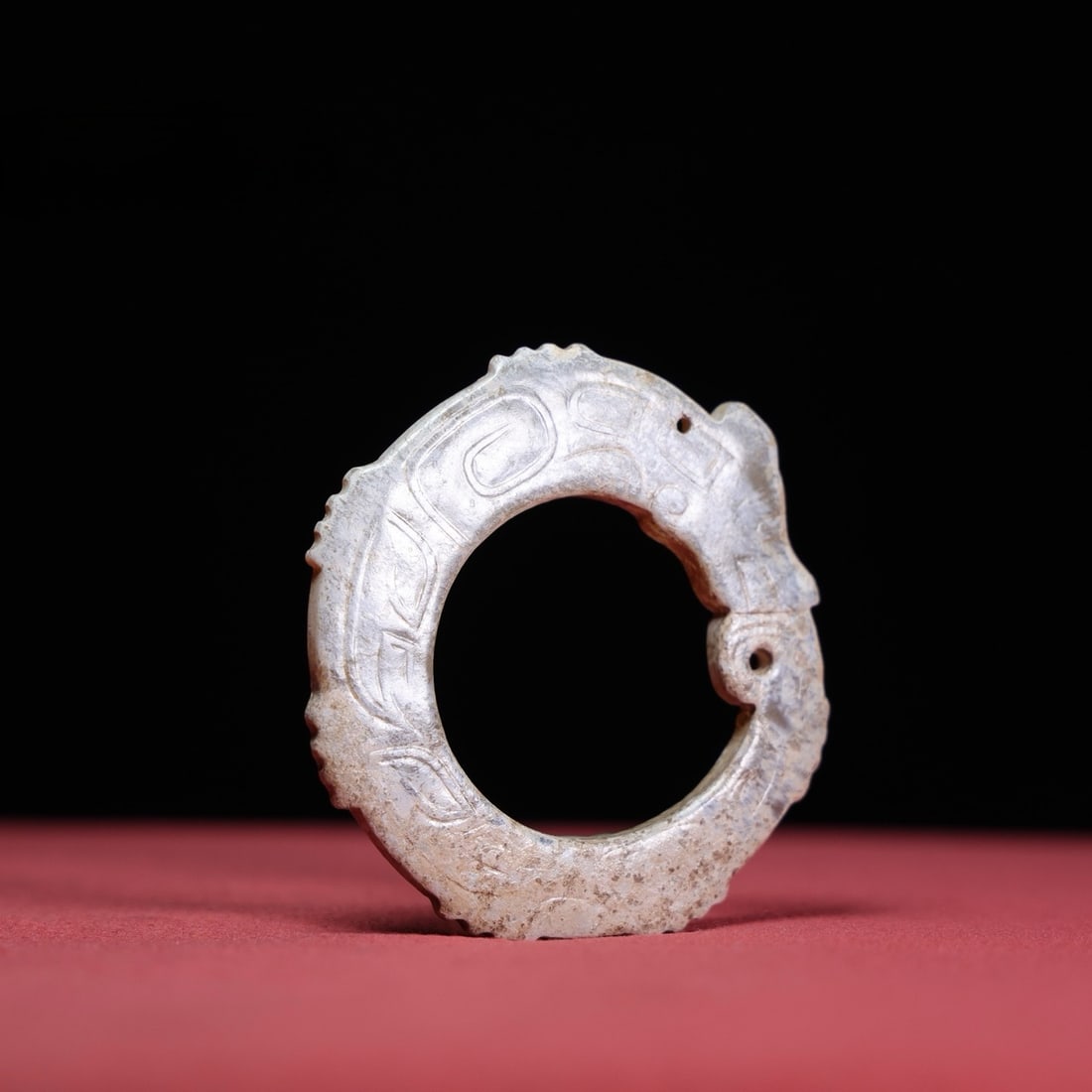 An Exquisite White Jade Dragon Pattern Ornament: An Exquisite White Jade Dragon Pattern Ornament Han Dynasty, China Size:2.4inx2.2inx0.2in Weight:23g白玉龙环 中国汉代 Size:6cmx5.7cmx0.4cm Weight:23g