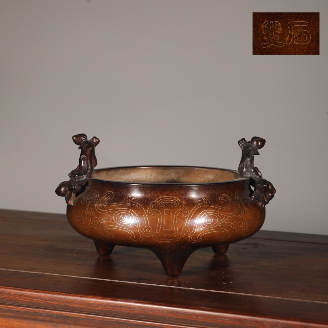 An Exquisite Bronze Inlaid Silver Beast-Face Pattern Double-Ears and Tripod Censer: An Exquisite Bronze Inlaid Silver Beast-Face Pattern Double-Ears and Tripod Censer Ming Dynasty, China Size:4.1inx6.3in