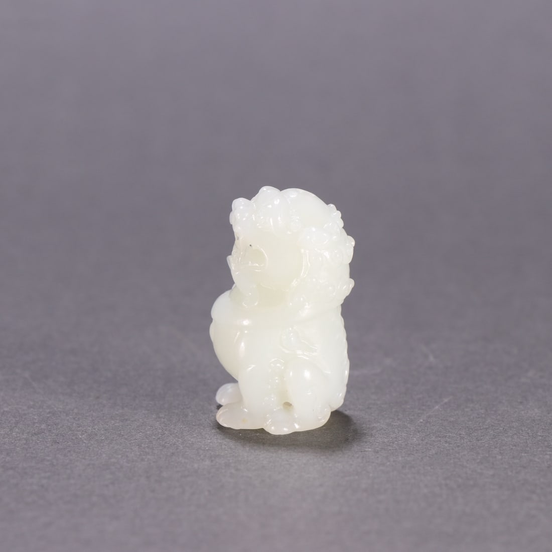 An Exquisite White Jade Lion Ornament (1 of 9)
