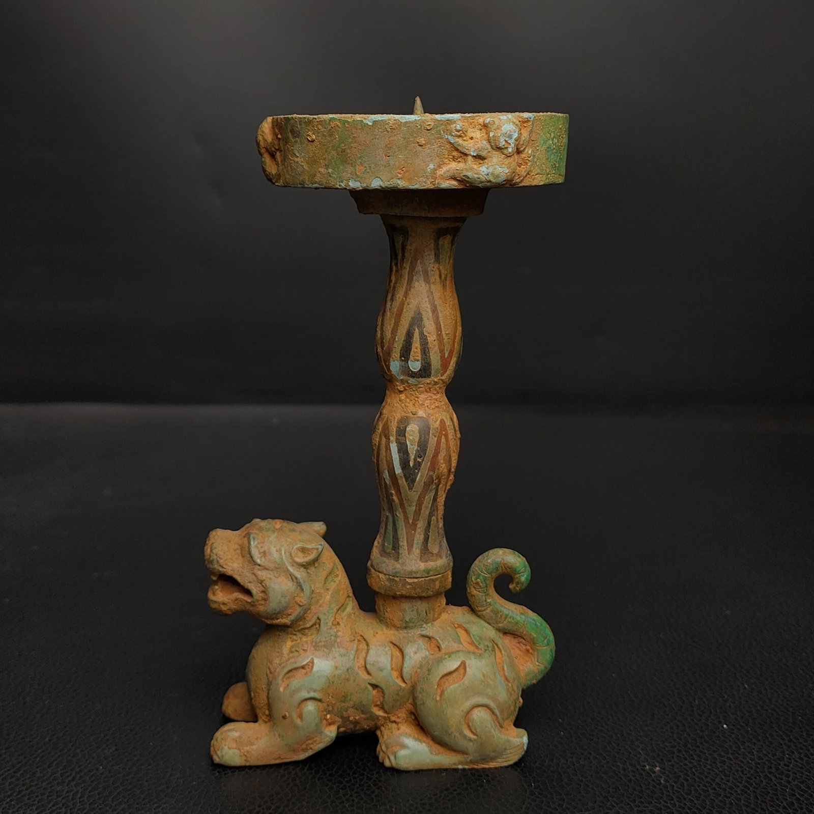 An Exquisite Bronze Auspicious Beast -Shaped Candlestick: An Exquisite Bronze Auspicious Beast -Shaped Candlestick Han Dynasty, China Size:5.5inx3.1in Weight:0.6kg错彩瑞兽形青铜灯