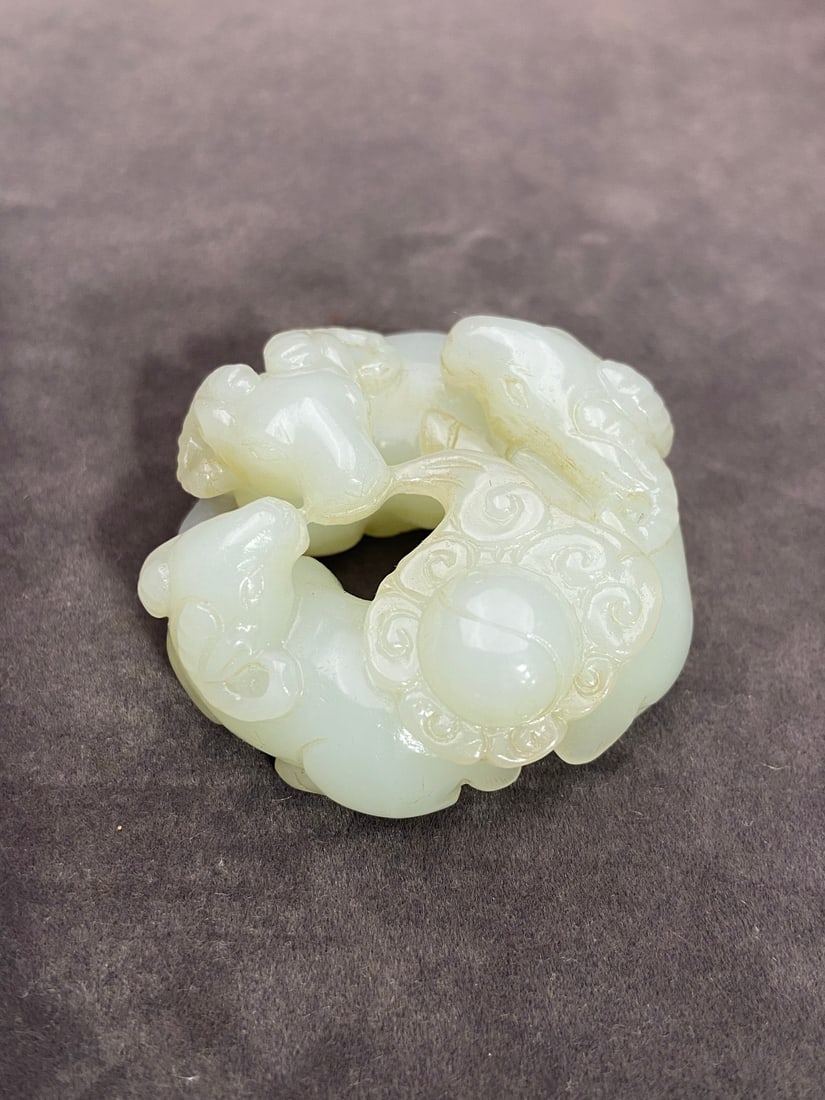 An Exquisite White Jade Sheep Hand Piece: An Exquisite White Jade Sheep Hand Piece Qing Dynasty, China Size:55.8mmx56.2mmx27mm Weight:93g白玉三阳开泰手把件