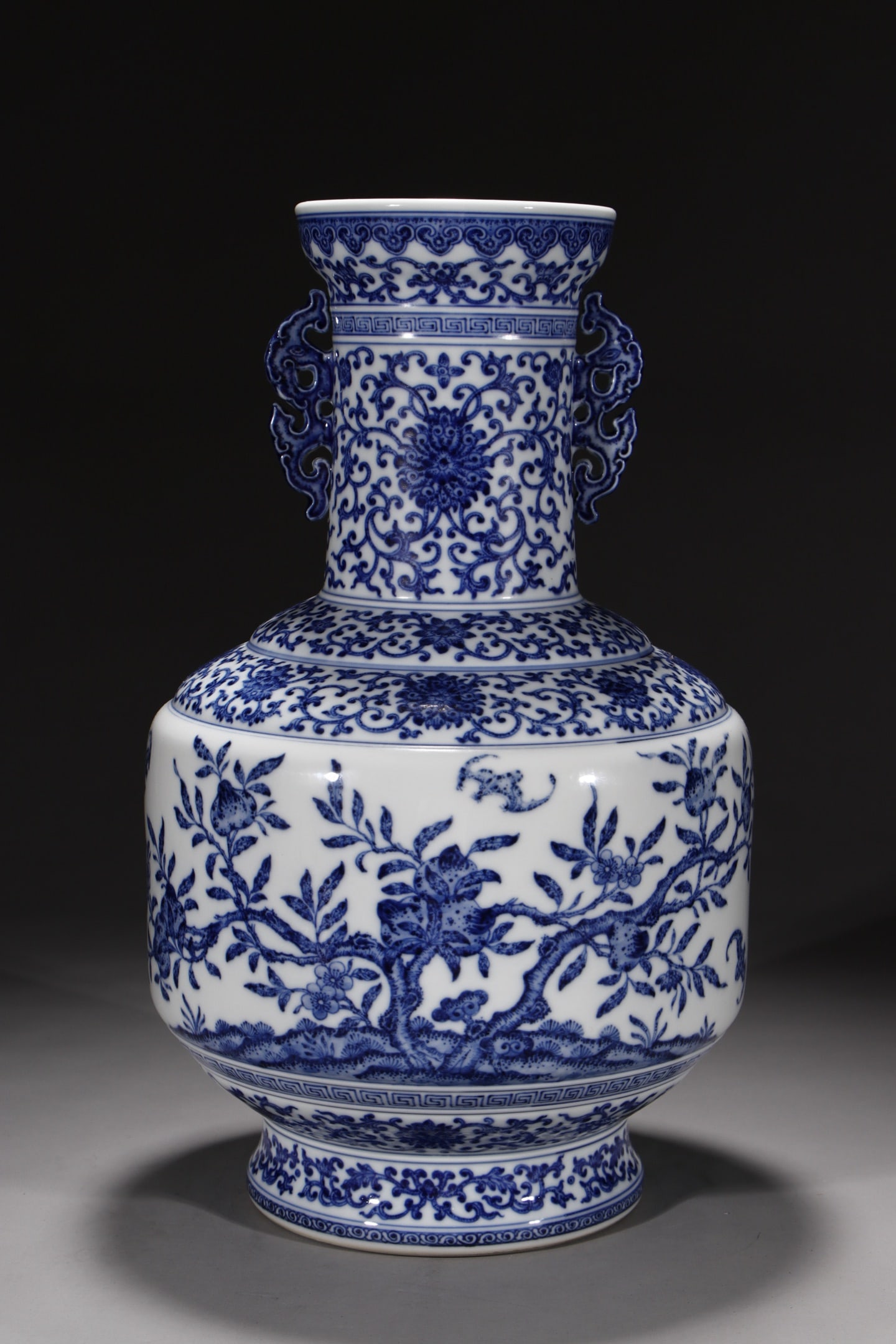 An Exquisite Blue and White Lotus Pattern Bats and Peach Pattern Double-Ears Vase: An Exquisite Blue and White Lotus Pattern Bats and Peach Pattern Double-Ears Vase Qing Dynasty, China Qianlong Six-character Mark Size:16.1in青花缠枝穿花九