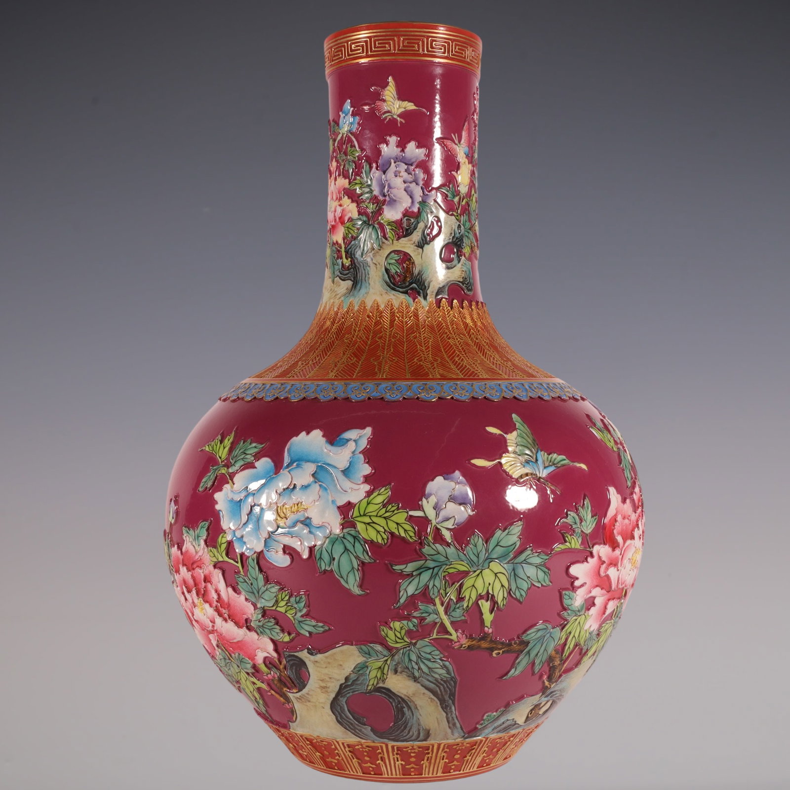 An Exquisite Enamel Ruby Red-Glazed Painted Gold Flower and Butterfly Pattern Vase: An Exquisite Enamel Ruby Red-Glazed Painted Gold Flower and Butterfly Pattern Vase Qing Dynasty, China Qianlong Six-character Mark Size:13inx8.3in珐琅彩胭脂红༕