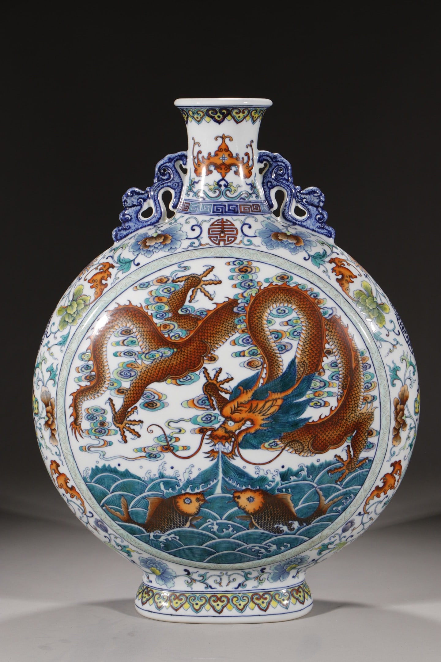 An Exquisite Doucai Bats and Peach Pattern Lotus Pattern Dragon Pattern Double-Ears Vase: An Exquisite Doucai Bats and Peach Pattern Lotus Pattern Dragon Pattern Double-Ears Vase Qing Dynasty, China Qianlong Six-character Mark Size:22.8in斗彩缠枝龙纹