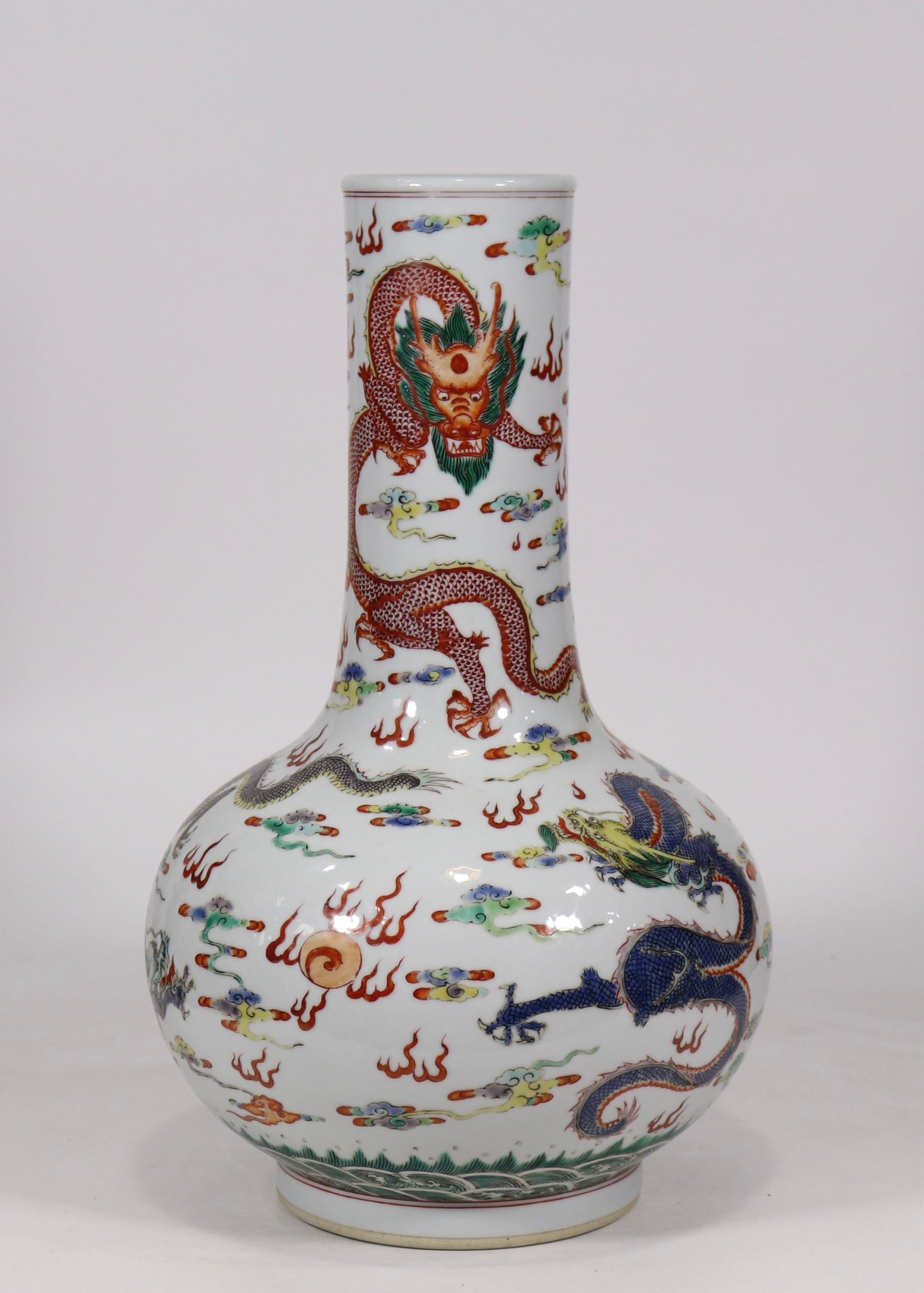 An Exquisite Wucai Dragon Pattern Seawater Pattern Vase: An Exquisite Wucai Dragon Pattern Seawater Pattern Vase Qing Dynasty, China Kangxi Six-character Mark Size:17.7inx9.8in五彩五龙长颈瓶 中国清