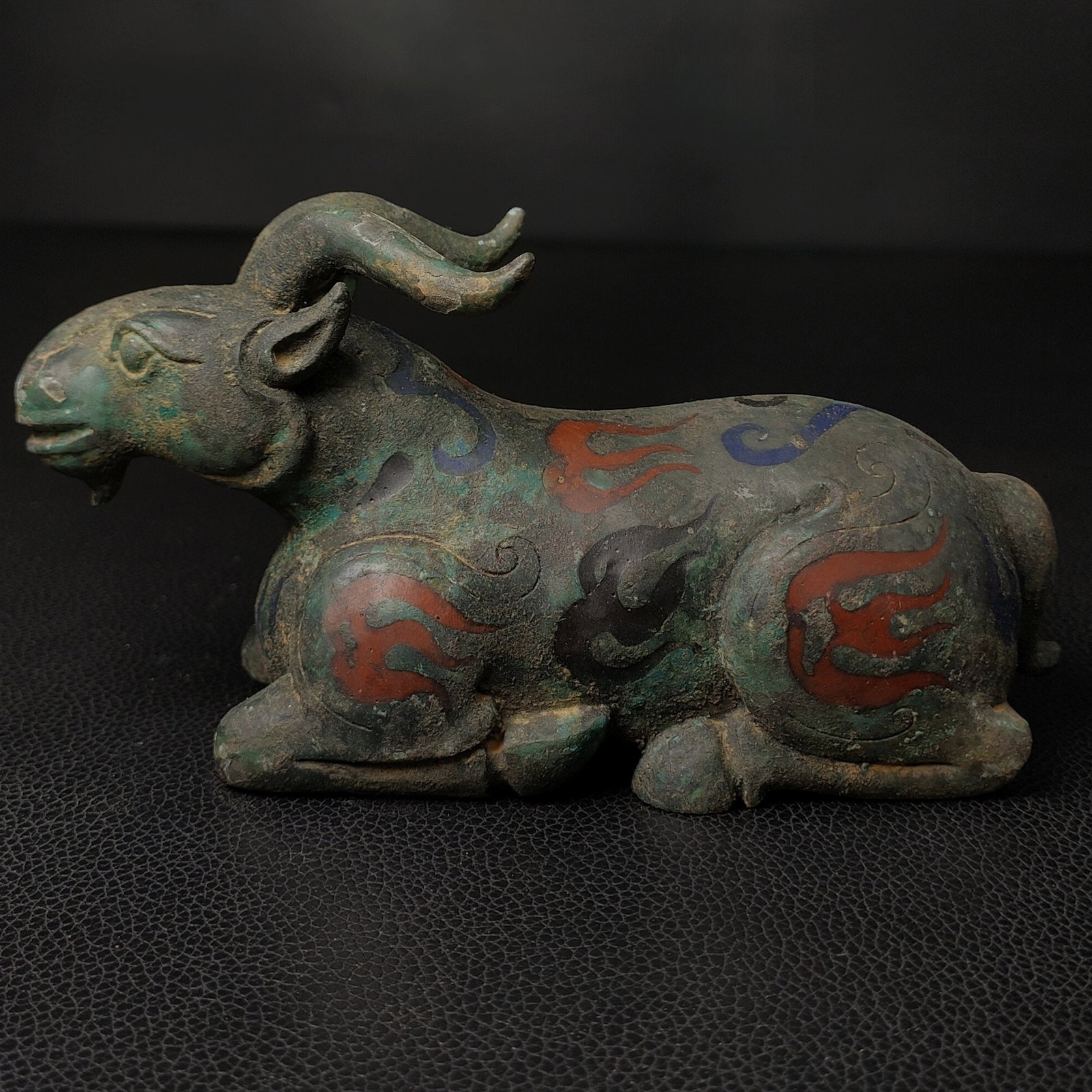 An Exquisite Bronze Sheep Ornament: An Exquisite Bronze Sheep Ornament the Warring States period in China Size:3.5inx6.3in Weight:0.5kg错彩青铜卧羊摆件 战国时期