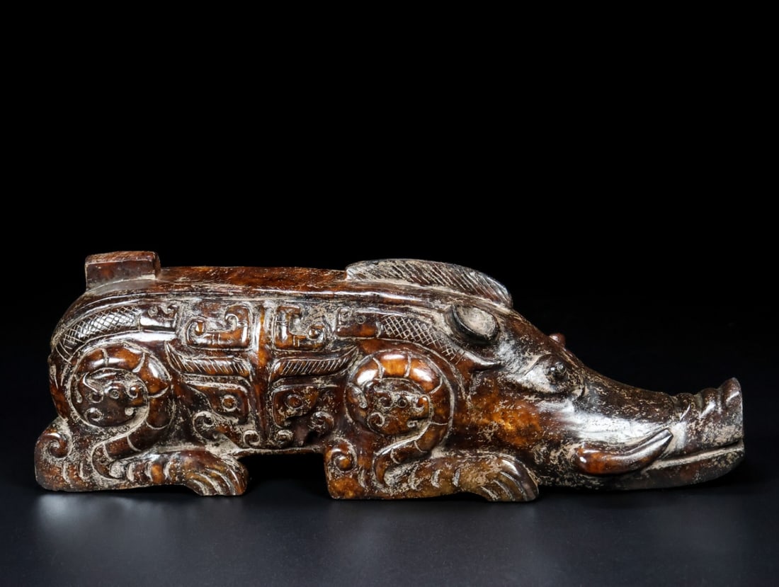 An Exquisite White Jade Wild Pig: An Exquisite White Jade Wild Pig Han Dynasty, China Size:8.7inx3inx2.4in Weight:1.32kg白玉野猪 中国汉代 Size:22.2cmx7.5cmx6.1cm Weight:1.32kg