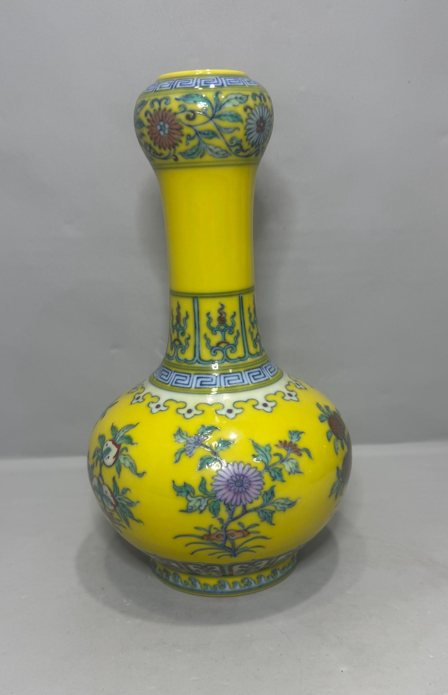 An Exquisite Doucai Flower and Fruit Pattern Vase: An Exquisite Doucai Flower and Fruit Pattern Vase Qing Dynasty, China Yongzheng Six-character Mark Size:9.1in斗彩三花三果蒜头瓶