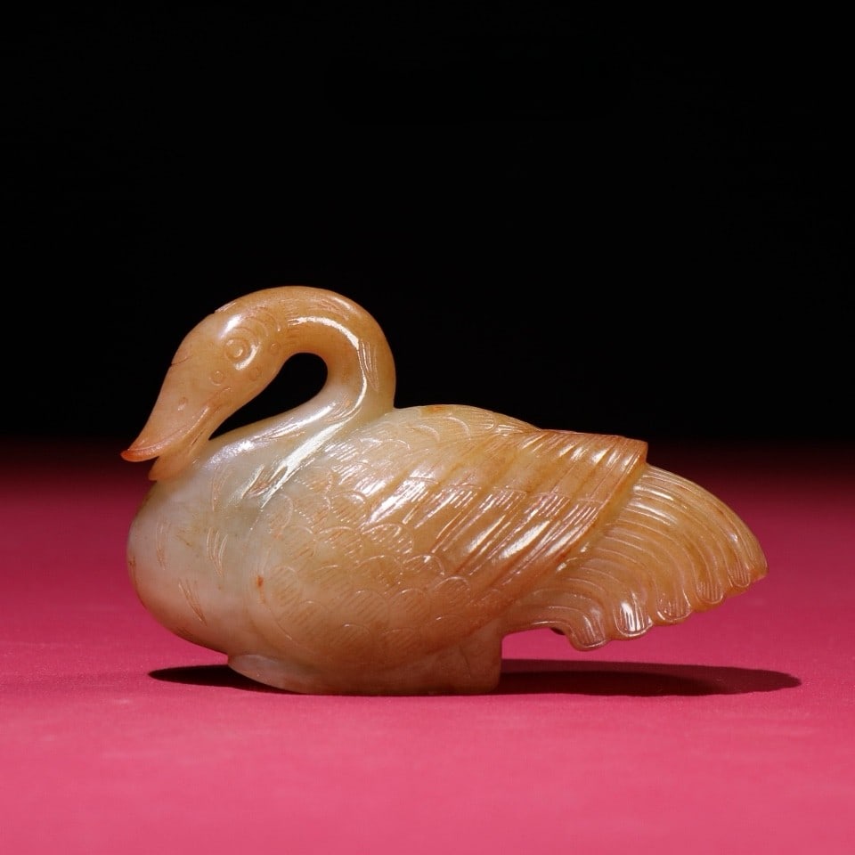 An Exquisite Yellow Jade Duck Hand Piece: An Exquisite Yellow Jade Duck Hand Piece Han Dynasty, China Size:3.8inx2.4inx1.5in Weight:238g黄玉鸭把件 中国汉代 Size:9.6cmx6.1cmx3.8cm