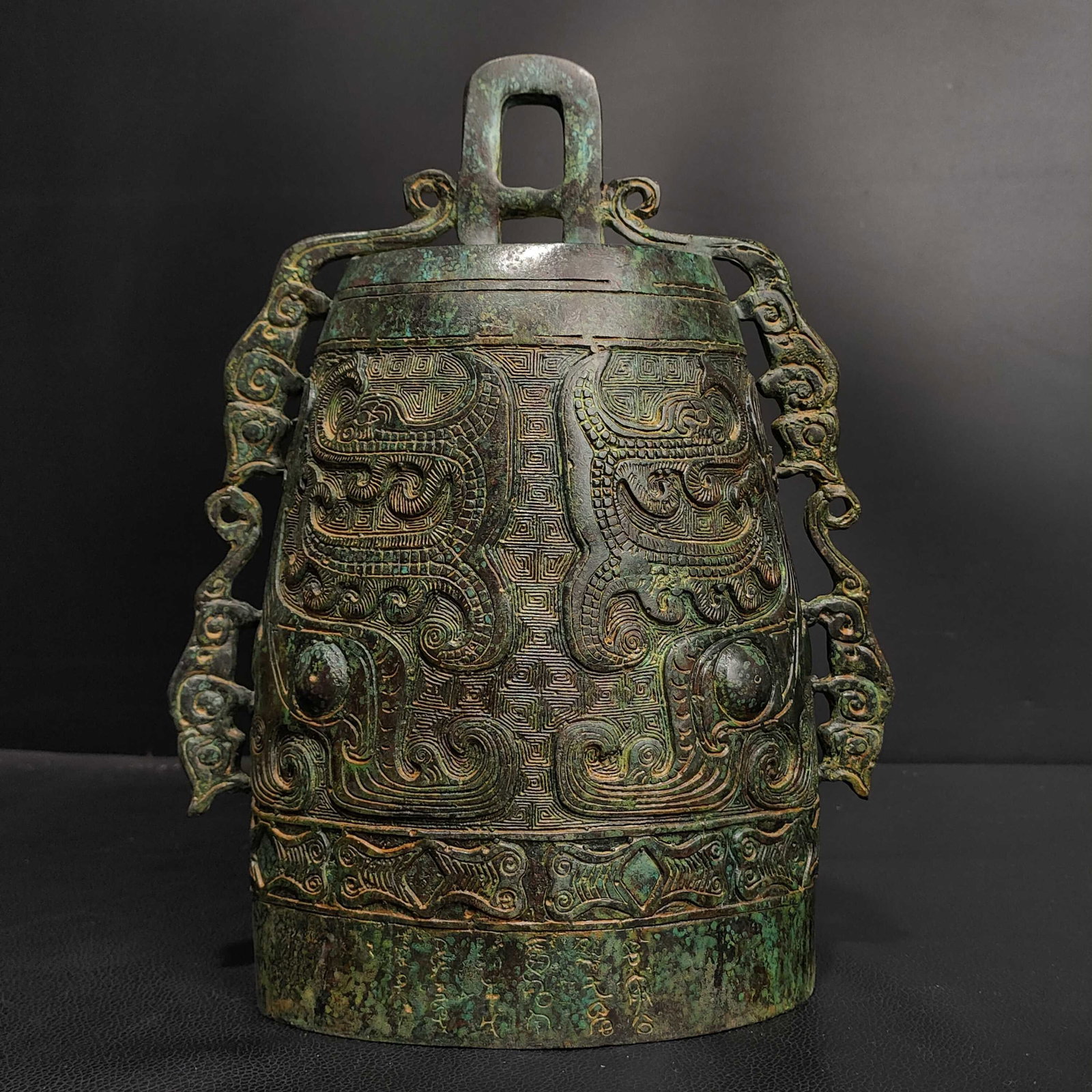 An Exquisite Bronze Dragon Pattern Ornament: An Exquisite Bronze Dragon Pattern Ornament N.Zhou , China Size:6.7inx3.9inx10.2in Weight:2.3kg青铜龙纹甬钟 商周时期 Size:17cmx10cmx26cm