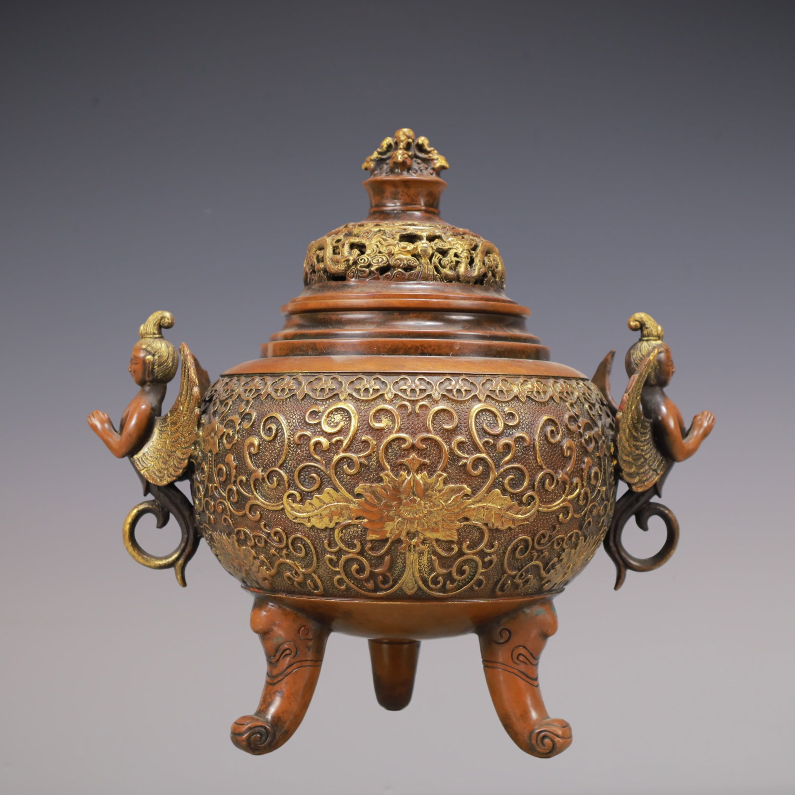 A Exquisite Gilt Bronze Lotus Pattern Dragon Pattern Double-Ears and Tripod Censer: A Exquisite Gilt Bronze Lotus Pattern Dragon Pattern Double-Ears and Tripod Censer Ming Dynasty, China Xuande Six-character Mark Size:11.2inx10.6in Weight:5950g铜鎏金缠枝