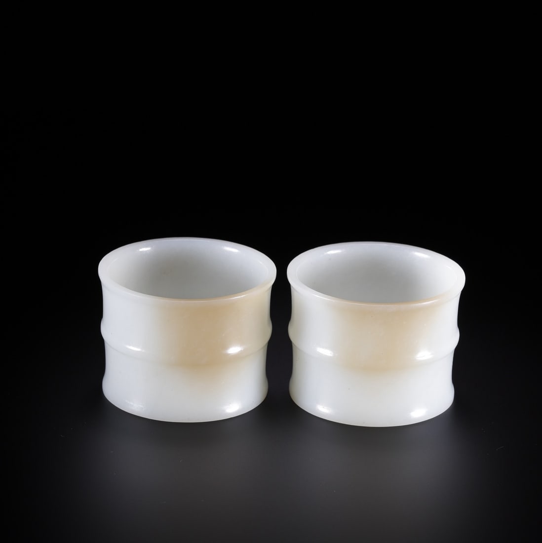 A Pair of Exquisite White Jade Cup: A Pair of Exquisite White Jade Cup Qing Dynasty, China Size:1.7inx2.3in Weight:149.5g白玉竹节杯一对 中国清代 Size:4.4cmx5.9cm Weight:1