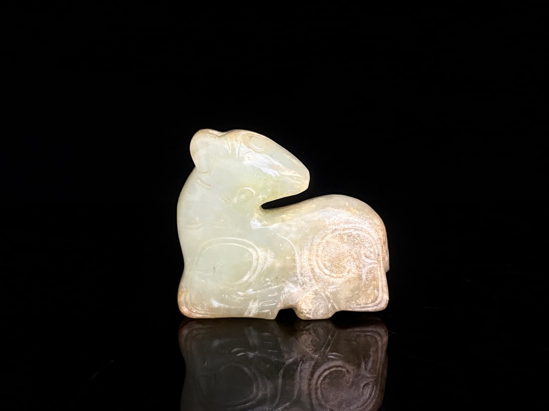 An Exquisite White Jade Auspicious Beast: An Exquisite White Jade Auspicious Beast S.Zhou , China Size:2.1inx1.9inx0.7in Weight:80g白玉瑞兽 商周时期 Size:5.3cmx4.7cmx1.8cm Weight:80g