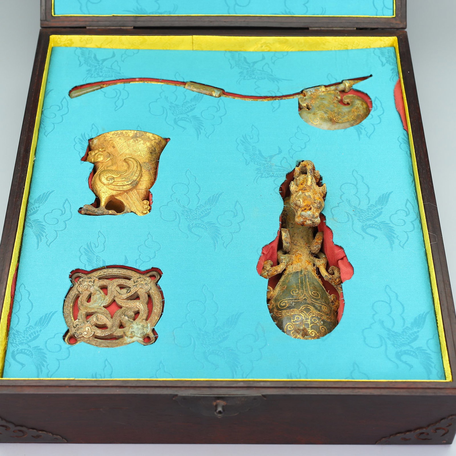 A Set of Fine Gilt Bronze Inlaid White Jade Beast-Face Pattern Hook Goblet: A Set of Fine Gilt Bronze Inlaid White Jade Beast-Face Pattern Hook Goblet Han Dynasty, China Size:17.3inx15.7in Size:12.6inx2.4in Size:7.9inx2.8in Size:3.5inx3.5in Size:3.9inx2.4in