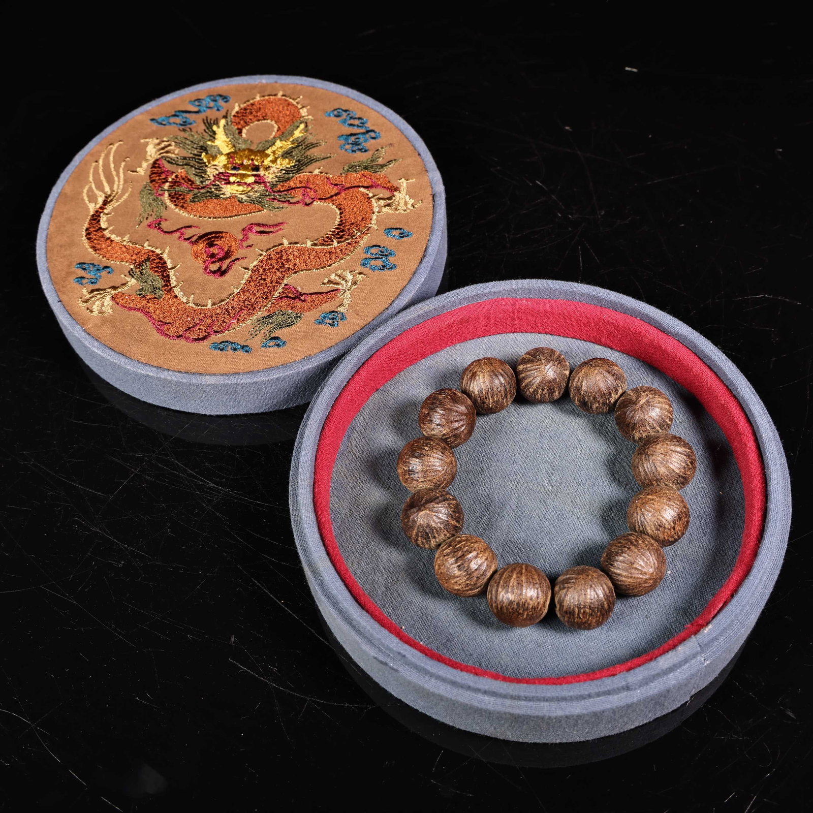 An Exquisite Eaglewood Bracelets: An Exquisite Eaglewood Bracelets Qing Dynasty, China Diameter Size:0.7in Weight:45g刺绣盒沉香手串 中国清代 Diameter Size:1.8cm Weight: