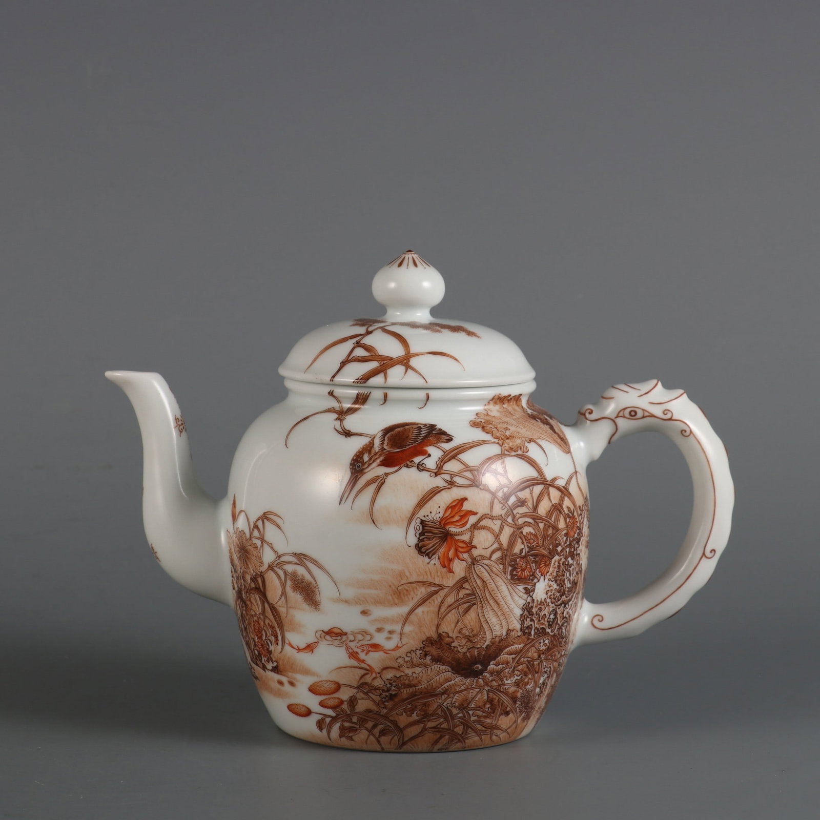 An Exquisite Ink Color Flower and Bird Pattern with poem Teapot: An Exquisite Ink Color Flower and Bird Pattern with poem Teapot Qing Dynasty, China Yongzheng Six-character Mark Size:5.2inx6.9in墨彩花鸟纹龙首茶壶