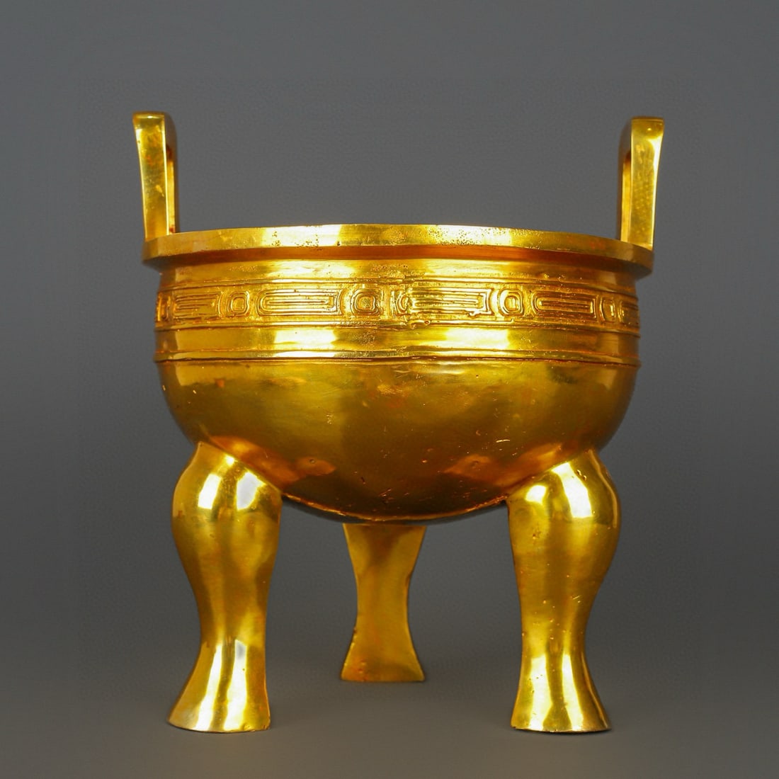 An Exquisite Gilt Bronze Double-Ears and Tripod Censer: An Exquisite Gilt Bronze Double-Ears and Tripod Censer W.Zhou , China Size:11.4inx12.6in Weight:8100g铜鎏金毛公鼎 西周时期 Size:29cmx32cm