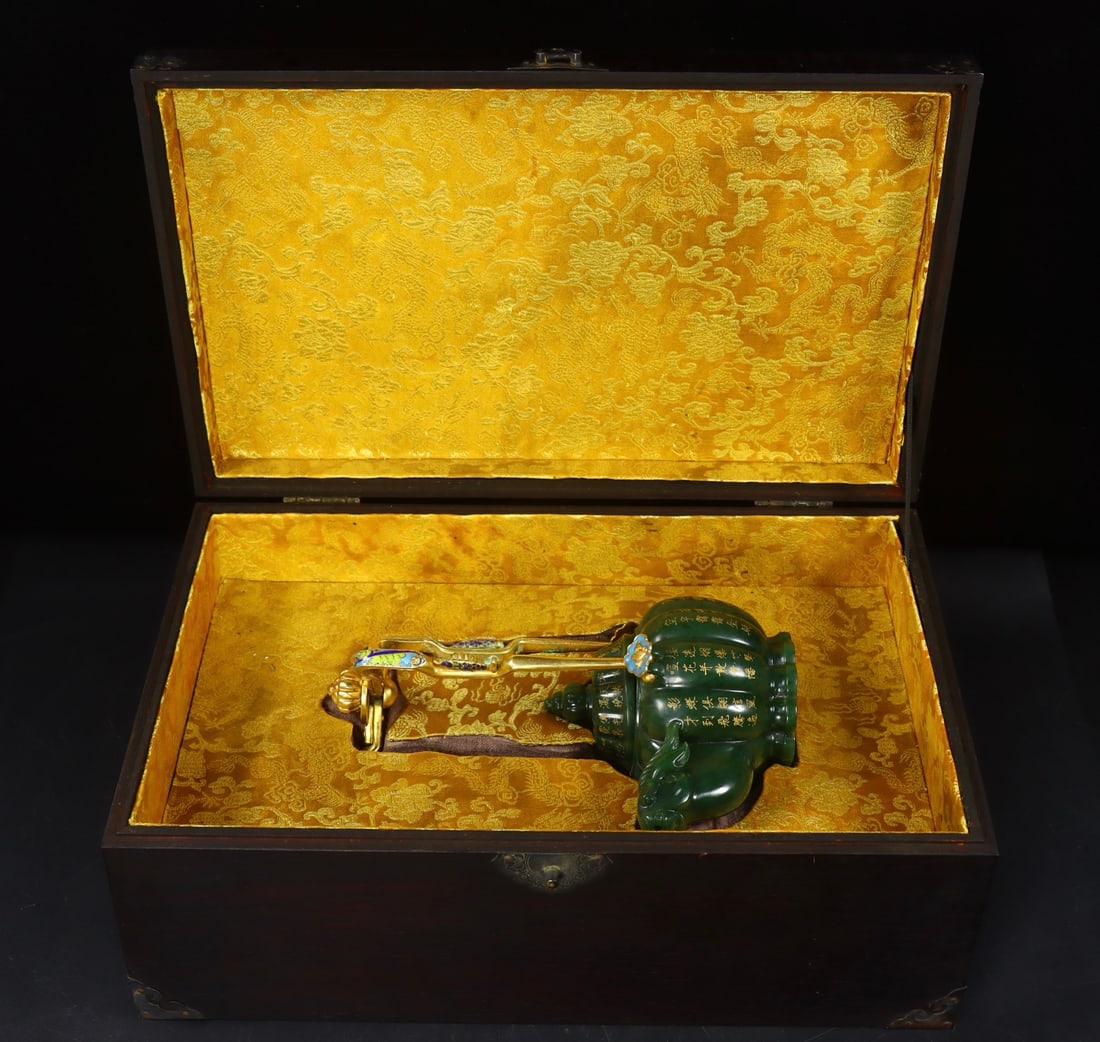 An Exquisite Jasper Inlaid Gilt Bronze with poem Ewer: An Exquisite Jasper Inlaid Gilt Bronze with poem Ewer Qing Dynasty, China Qianlong Four-character Mark Size:9.4inx5.9inx4.1in Weight:954g碧玉羊头壶