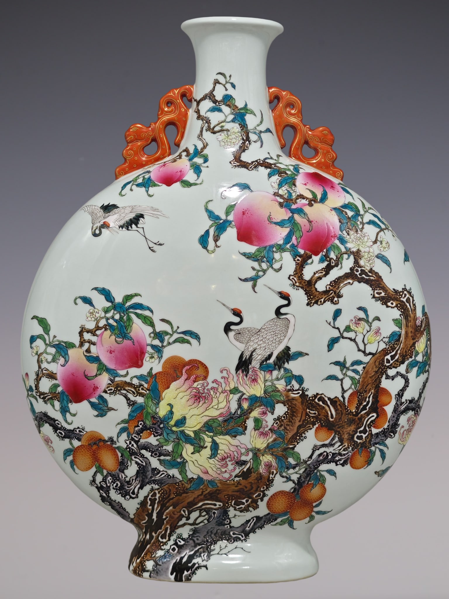 An Exquisite Enamel Flower and Bird Pattern Double-Ears Vase: An Exquisite Enamel Flower and Bird Pattern Double-Ears Vase Qing Dynasty, China Qianlong Six-character Mark Size:22.6inx16.5in珐琅彩鹤寿三果纹双&