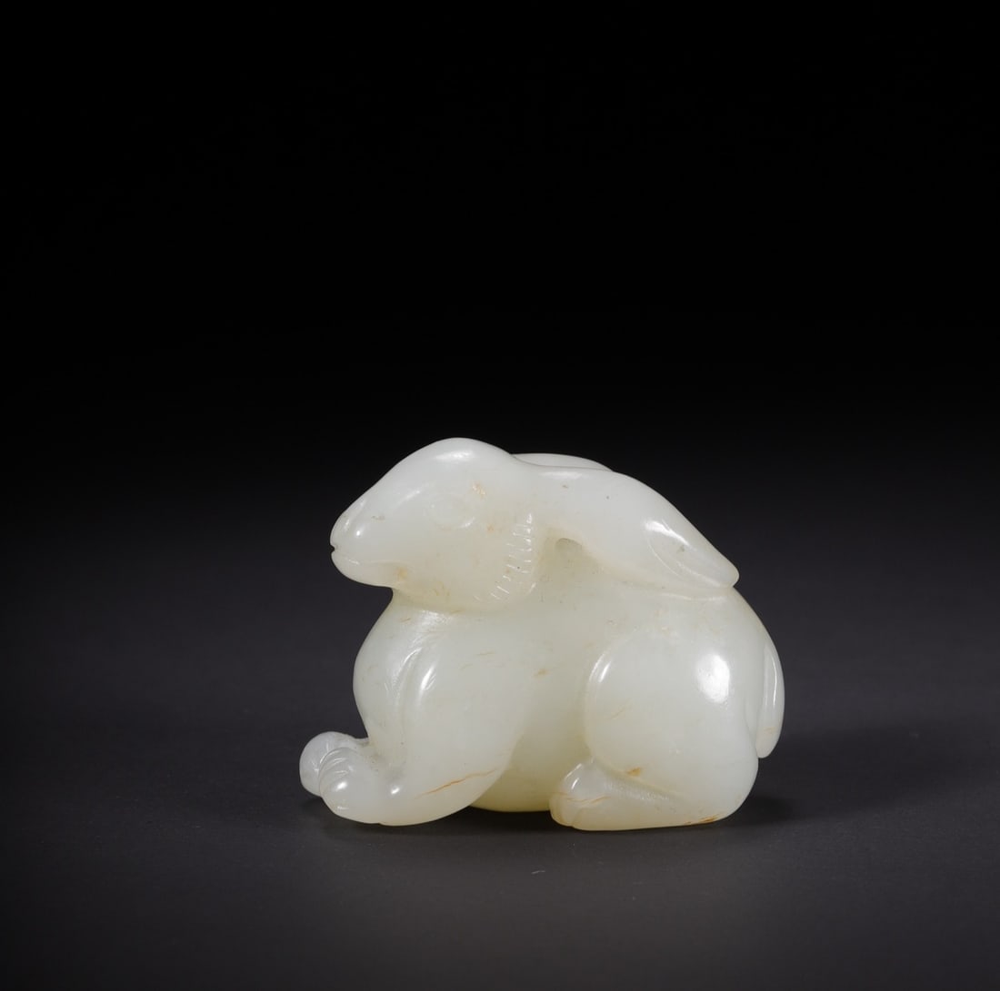 An Exquisite White Jade Rabbit: An Exquisite White Jade Rabbit Qing Dynasty, China Size:1.7inx1inx1.3in Weight:44.8g白玉兔子 中国清代 Size:4.2cmx2.5cmx3.2cm Weight:44.8g