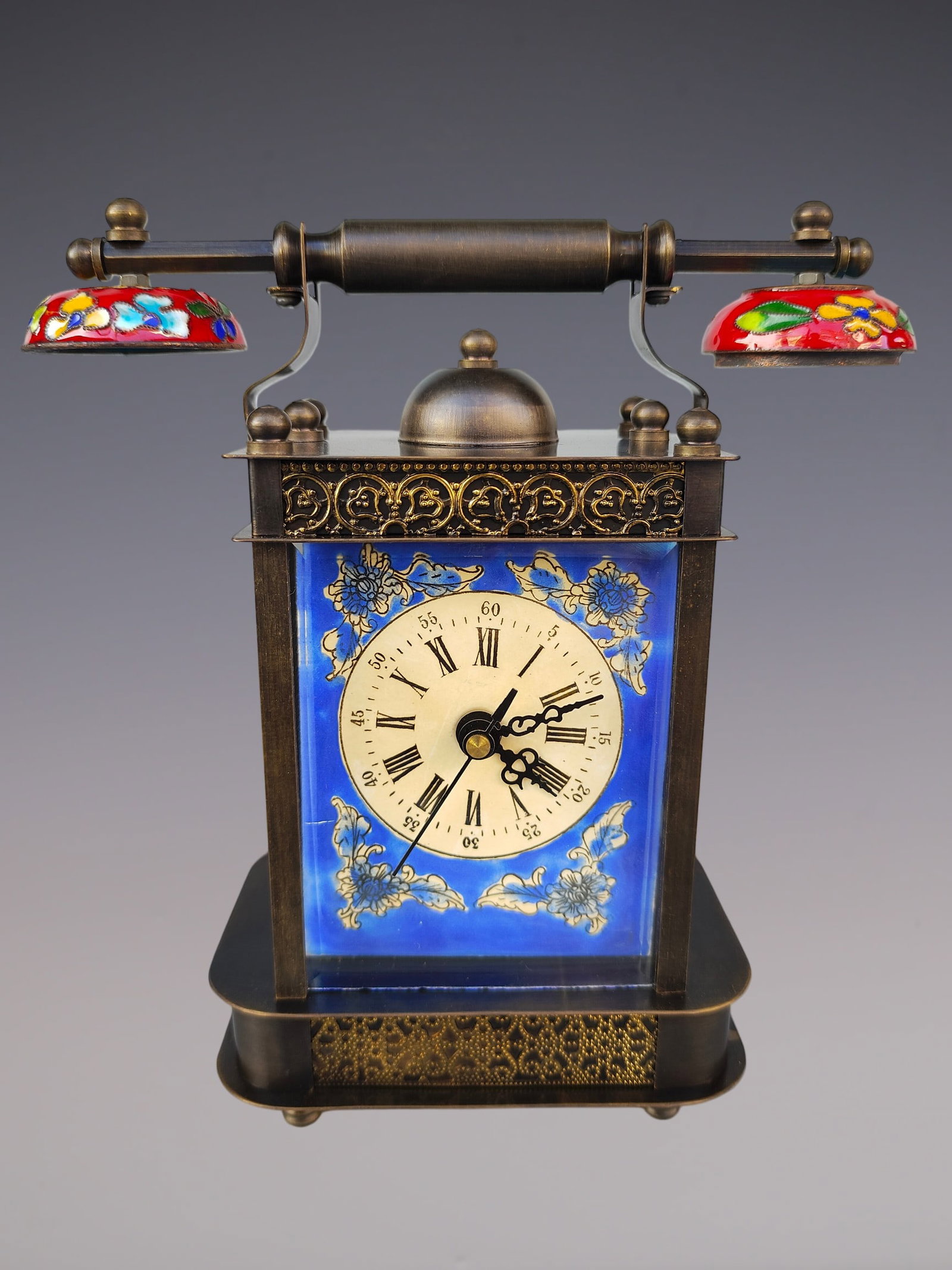 An Exquisite Bronze Lotus Pattern Clock: An Exquisite Bronze Lotus Pattern Clock Size:3.5inx7.1inx7.9in铜缠枝莲纹钟表 Size:9cmx18cmx20cm