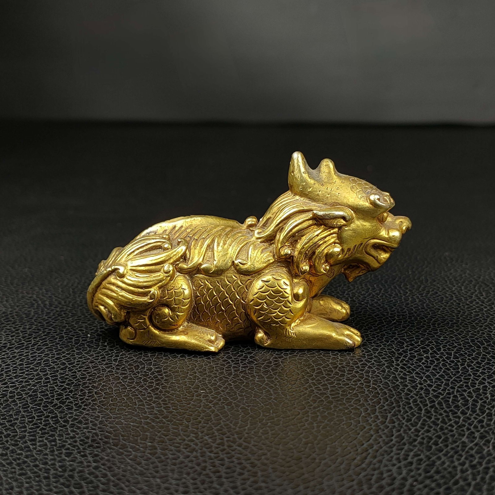 An Exquisite Gilt Bronze Auspicious Beast Paper Weight: An Exquisite Gilt Bronze Auspicious Beast Paper Weight Han Dynasty, China Size:2inx3.1in Weight:345g铜鎏金貔貅形席镇 中国汉代