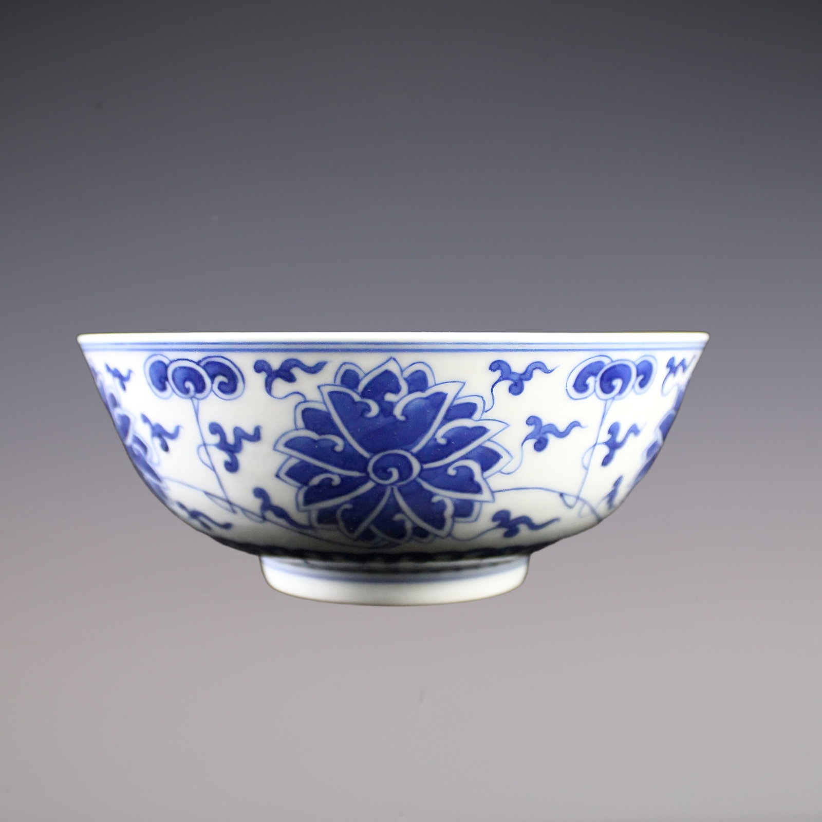 An Exquisite Blue and White Lotus Pattern Bowl: An Exquisite Blue and White Lotus Pattern Bowl Qing Dynasty, China Guangxu Six-character Mark Size:7.7inx2.6in青花缠莲碗 中国清代