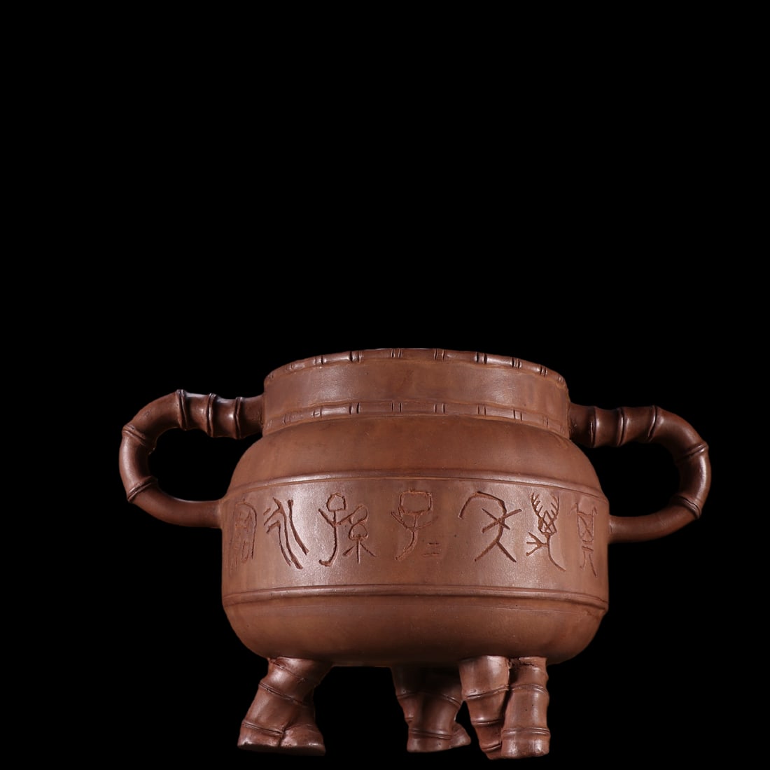 An Exquisite Purple Sands Double-Ears and Tripod Censer: An Exquisite Purple Sands Double-Ears and Tripod Censer the Republic of China Size:6.3inx9.8in紫砂竹节三足香炉 民国 Size:16cmx25cm