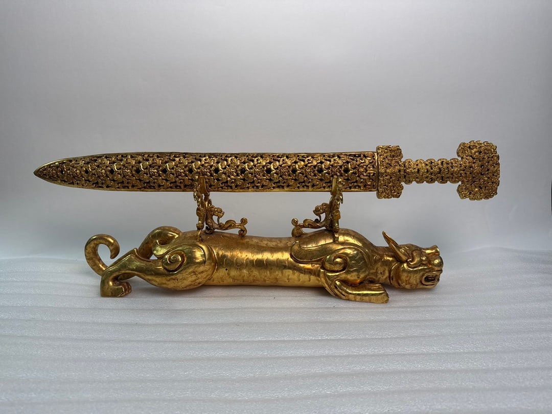 A Set of Fine Bronze Inlaid Gold and Silver Auspicious Beast Sword: A Set of Fine Bronze Inlaid Gold and Silver Auspicious Beast Sword Qing Dynasty, China Size:9.4inx28.5in Weight:8145g Size:28.5inx3.5in Weight:2772 Size:22.8inx7.7in