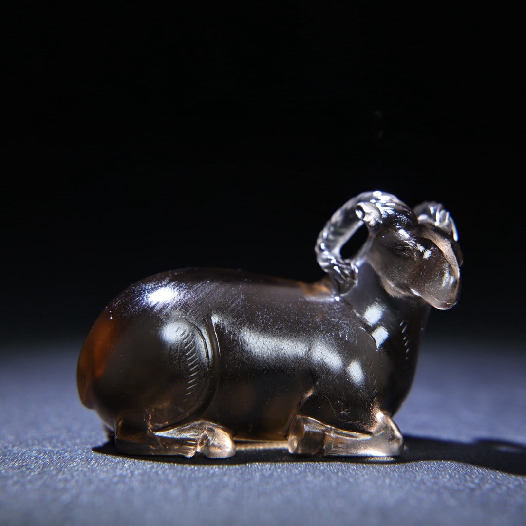 An Exquisite Crystal Sheep Hand Piece: An Exquisite Crystal Sheep Hand Piece Han Dynasty, China Size:2.4inx1.7inx1.2in Weight:96g水晶羊把件 中国汉代 Size:6cmx4.3cmx3.1cm Weight:96g