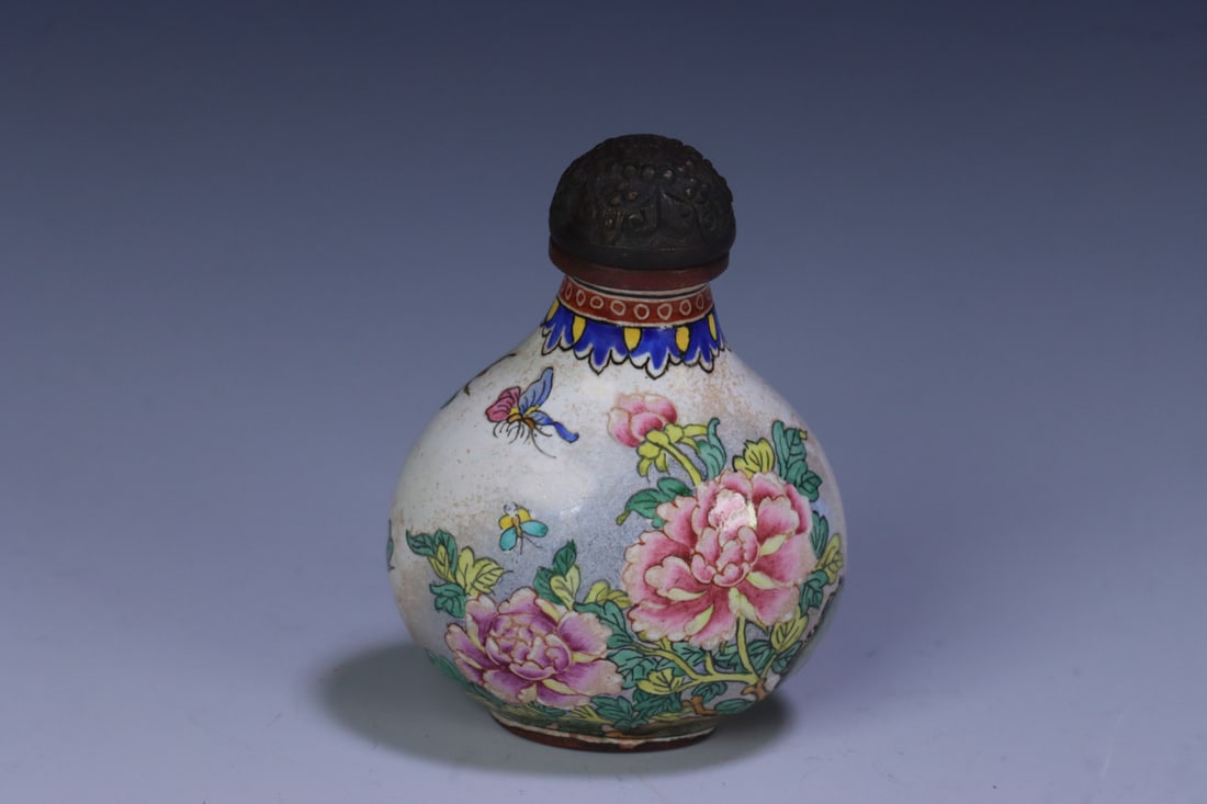 An Exquisite Bronze Painted Enamel Flower and Bird Pattern Snuff Bottle: An Exquisite Bronze Painted Enamel Flower and Bird Pattern Snuff Bottle Qing Dynasty, China Qianlong Four-character Mark Size:2inx1.5inx1.1in