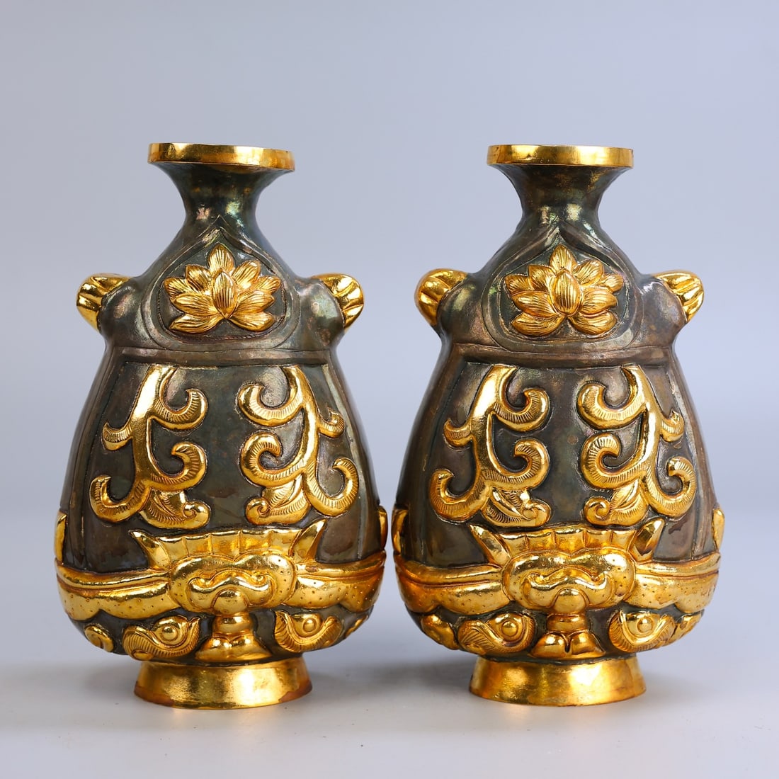 A Pair of Exquisite Gilt Bronze Flower Pattern Vase: A Pair of Exquisite Gilt Bronze Flower Pattern Vase Qing Dynasty, China Size:8.7inx4.7in Weight:770g铜鎏金浮雕花瓶一对 中国清