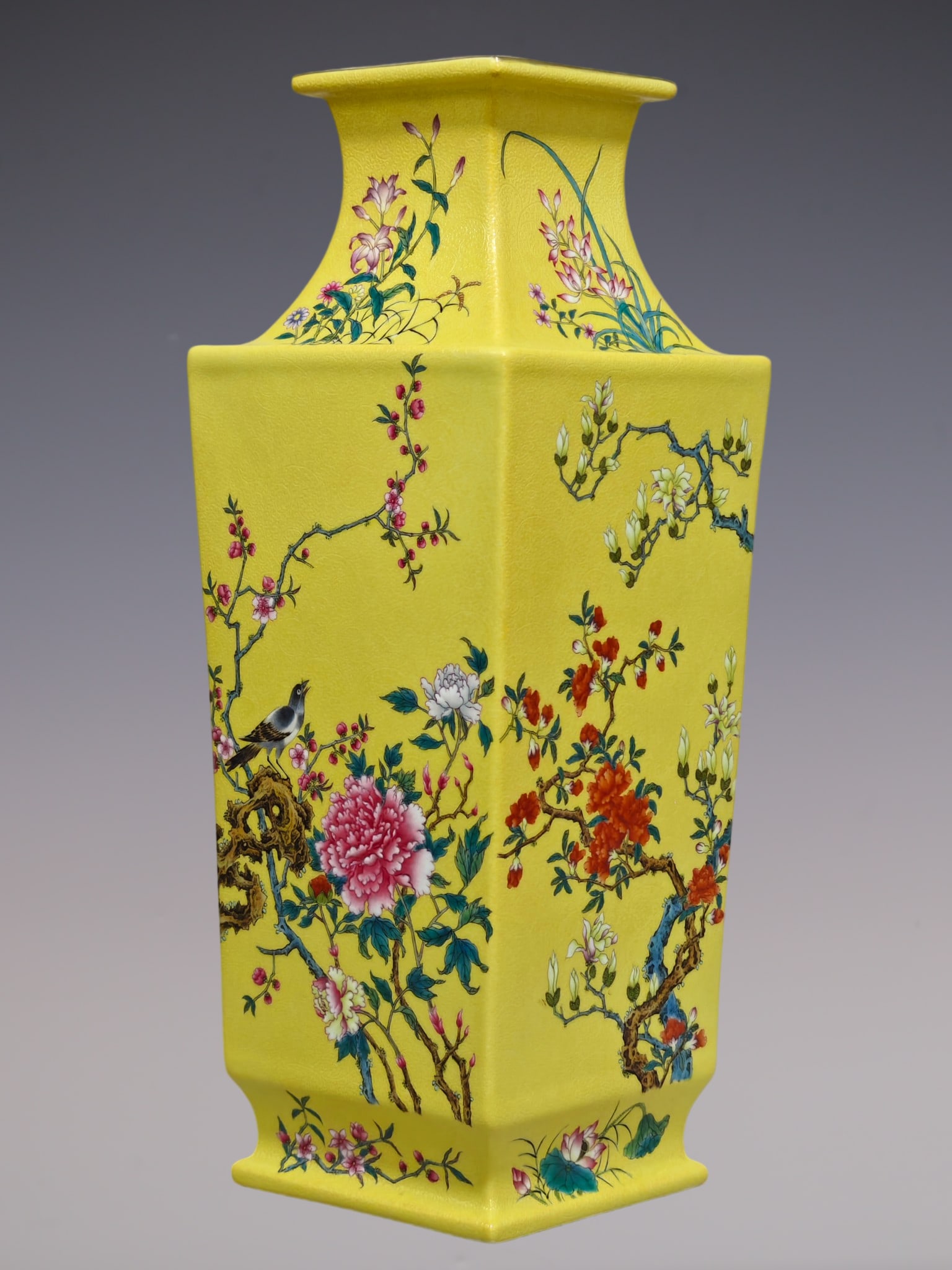 An Exquisite Famille-Rose Flower and Bird Pattern Vase: An Exquisite Famille-Rose Flower and Bird Pattern Vase Qing Dynasty, China Qianlong Six-character Mark Size:15.7inx5.7in粉彩黄底扒花四季花卉