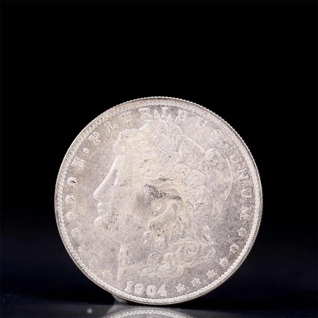 USA Morgan Dollar 1904 Coin: Obv: profile bust with date below and E PLURIBUS UNUM legend and stars around. Rev: eagle with In God we trust above within wreath with UNITED STATES OF AMERICA ONE DOLLAR legend. IN GOD WE TRUST /